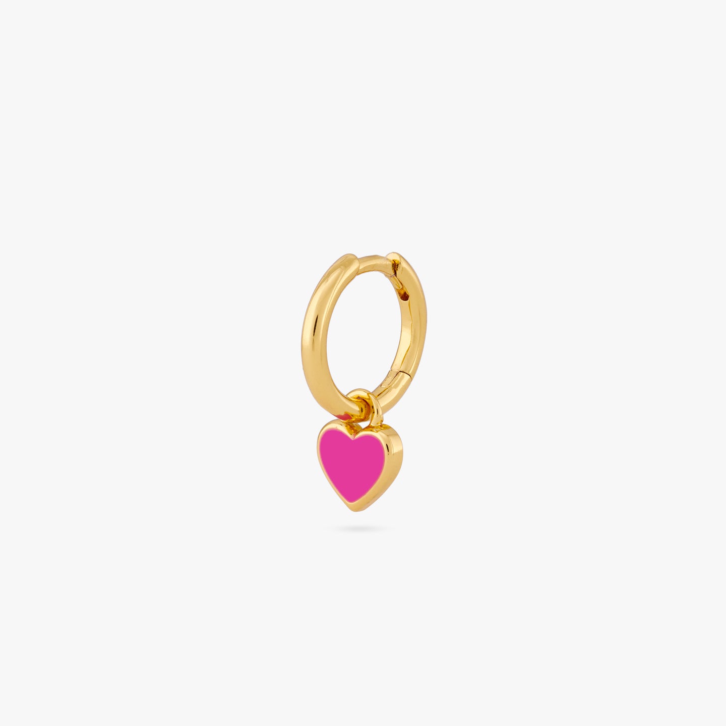A gold huggie with a pink enamel heart shaped charm color:null|gold