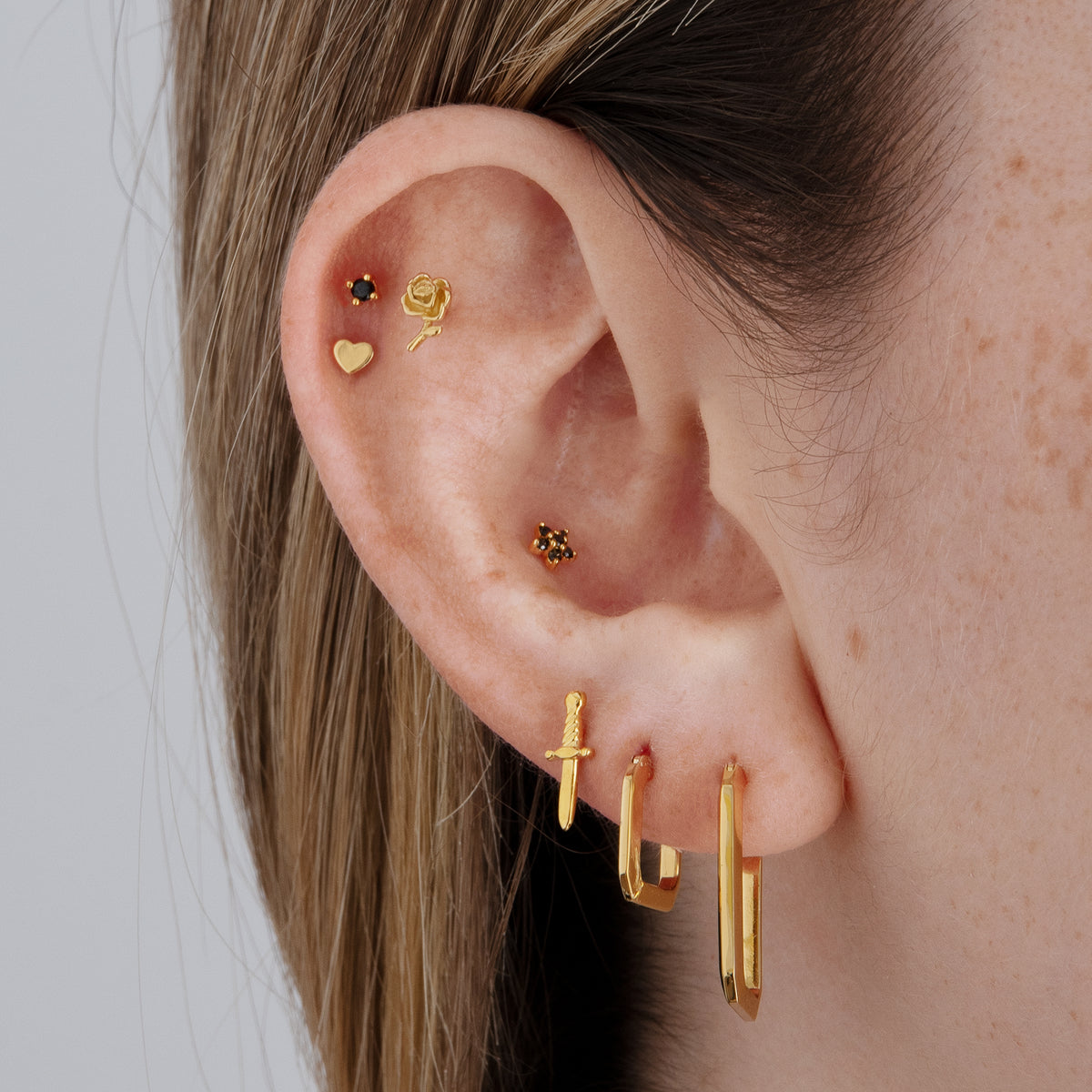 this image shows an earscape featuring the gold plated dagger stud