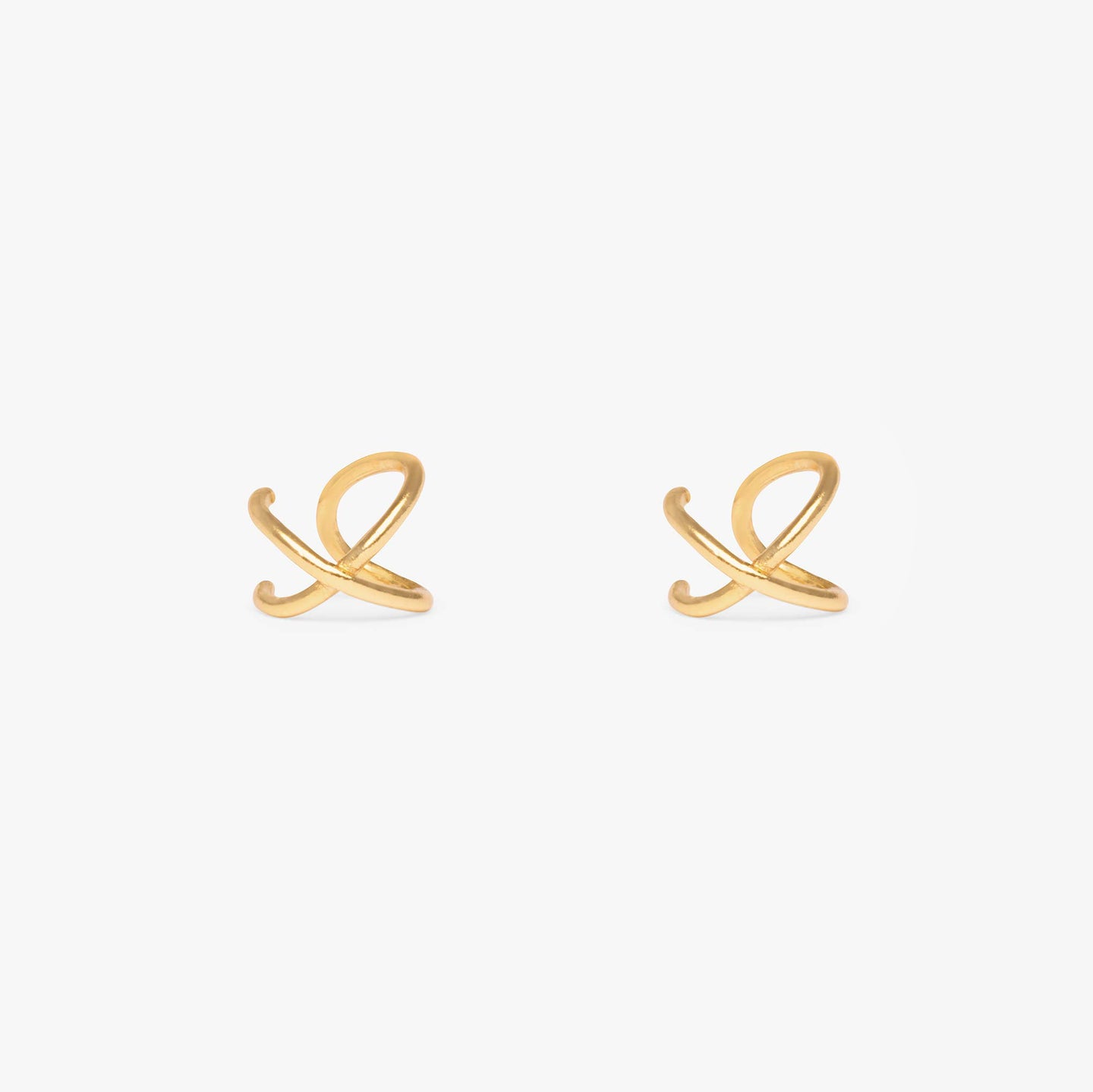 Cuff that crosses to form an X shape in gold. No piercing required. [pair] color:gold