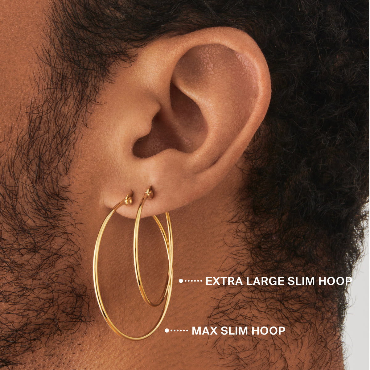 an extra large slim hoop in gold on ear [hover] color:null|gold