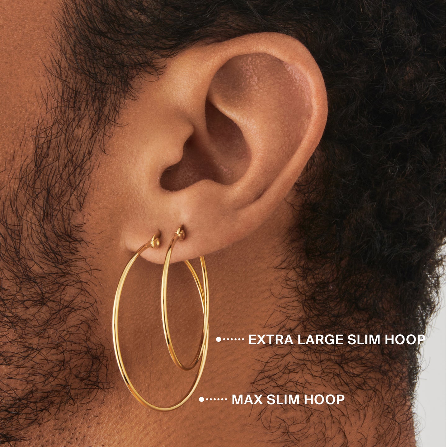 an extra large slim hoop in gold on ear [hover] color:null|gold