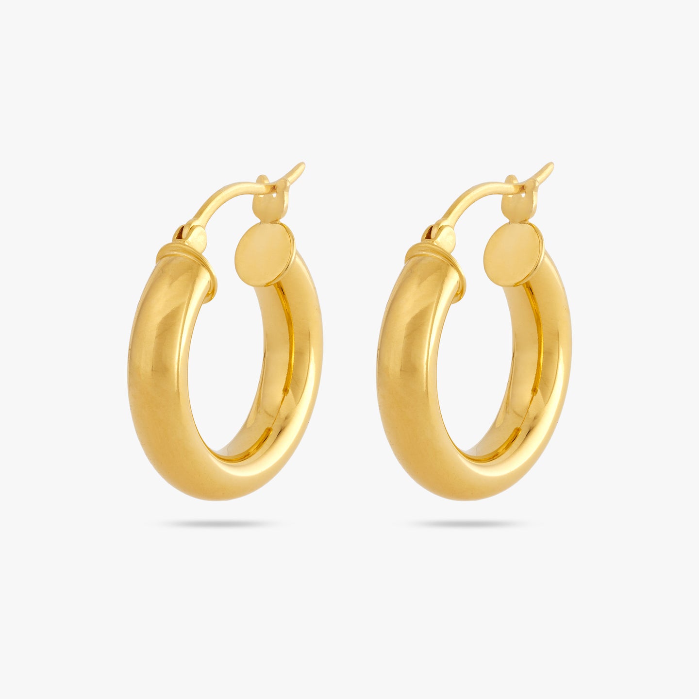 This is a pair of chunky gold tube hoops [pair] color:null|gold