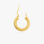This is a chunky gold tube hoop with its clasp undone 