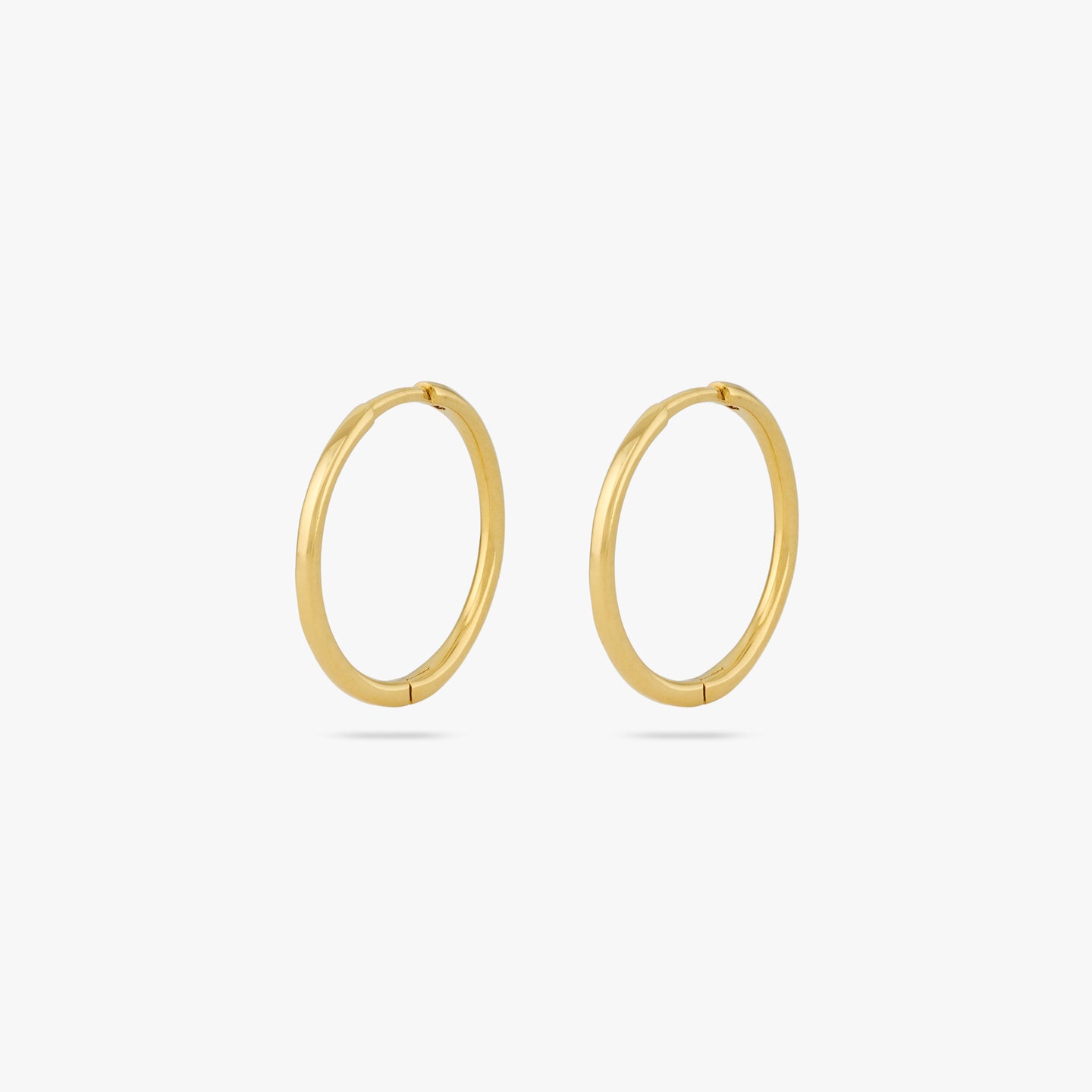 Pair of medium sized slim simple gold hoops. [pair] color:null|gold