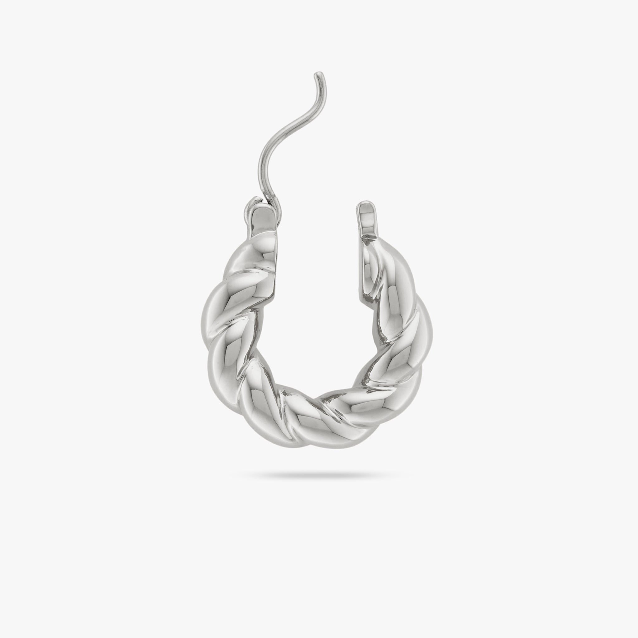 This is a small silver hoop with a twisted detail and the clasp opened color:null|silver