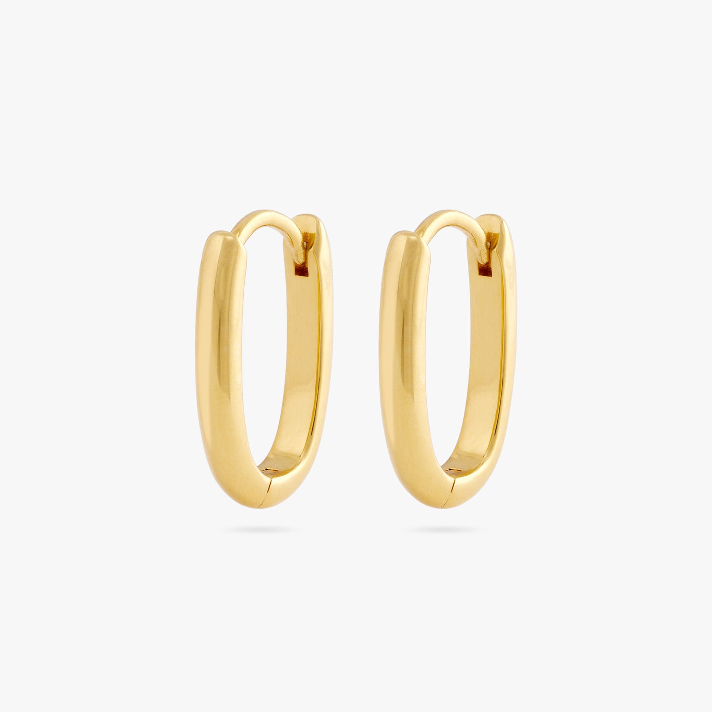A pair of medium sized gold hoops in the shape of an oval. [pair] color:null|gold