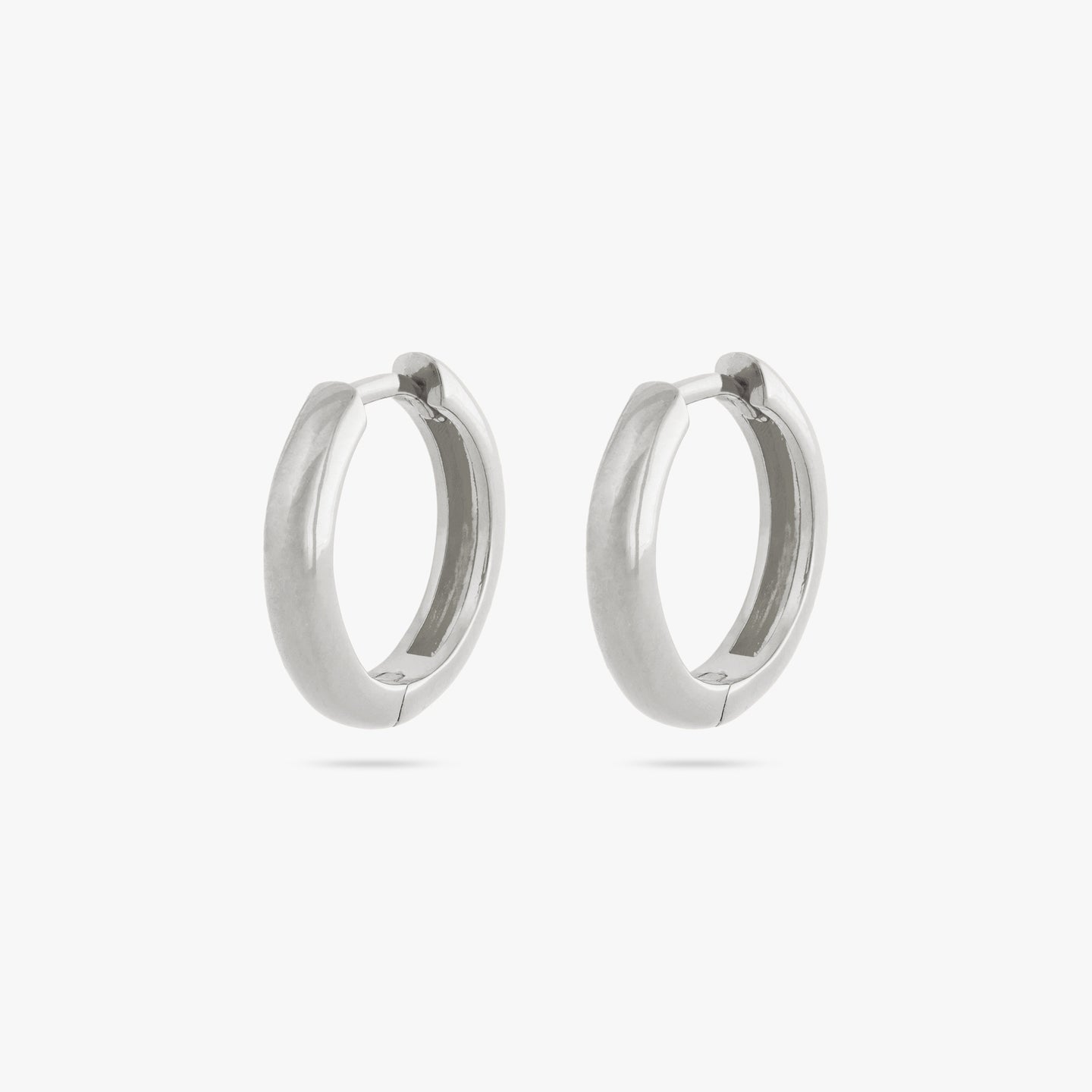 A pair of small bulky and chunky shaped silver hoops [pair] color:null|silver