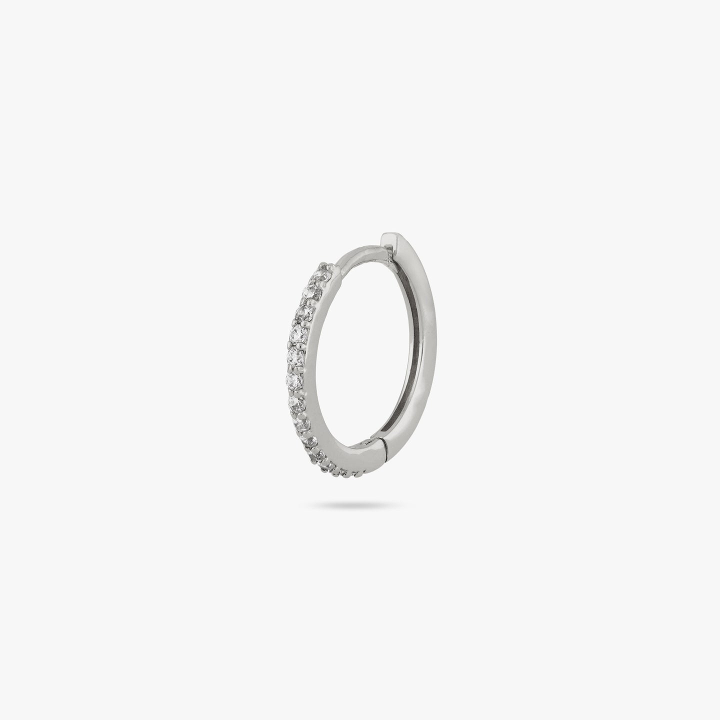 This is a small silver hoop with clear cz gems along the front color:null|silver/clear