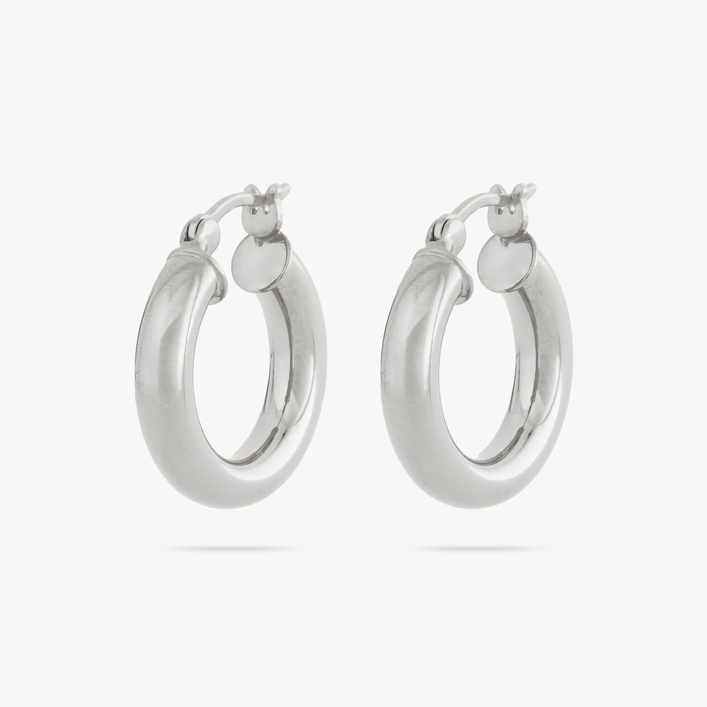 This is a pair of small silver chunky tube hoops [pair] color:null|silver