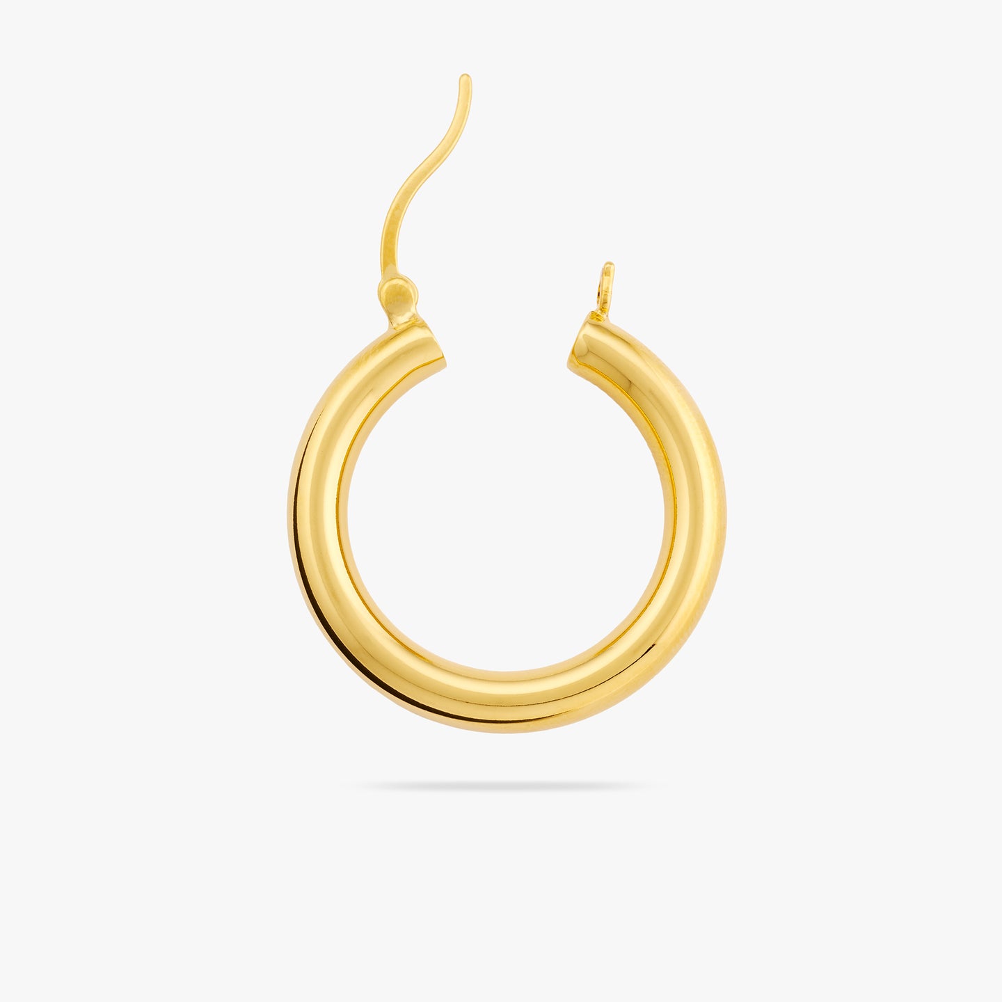 This is a large and thick gold hoop earring with the clasp undone color:null|gold
