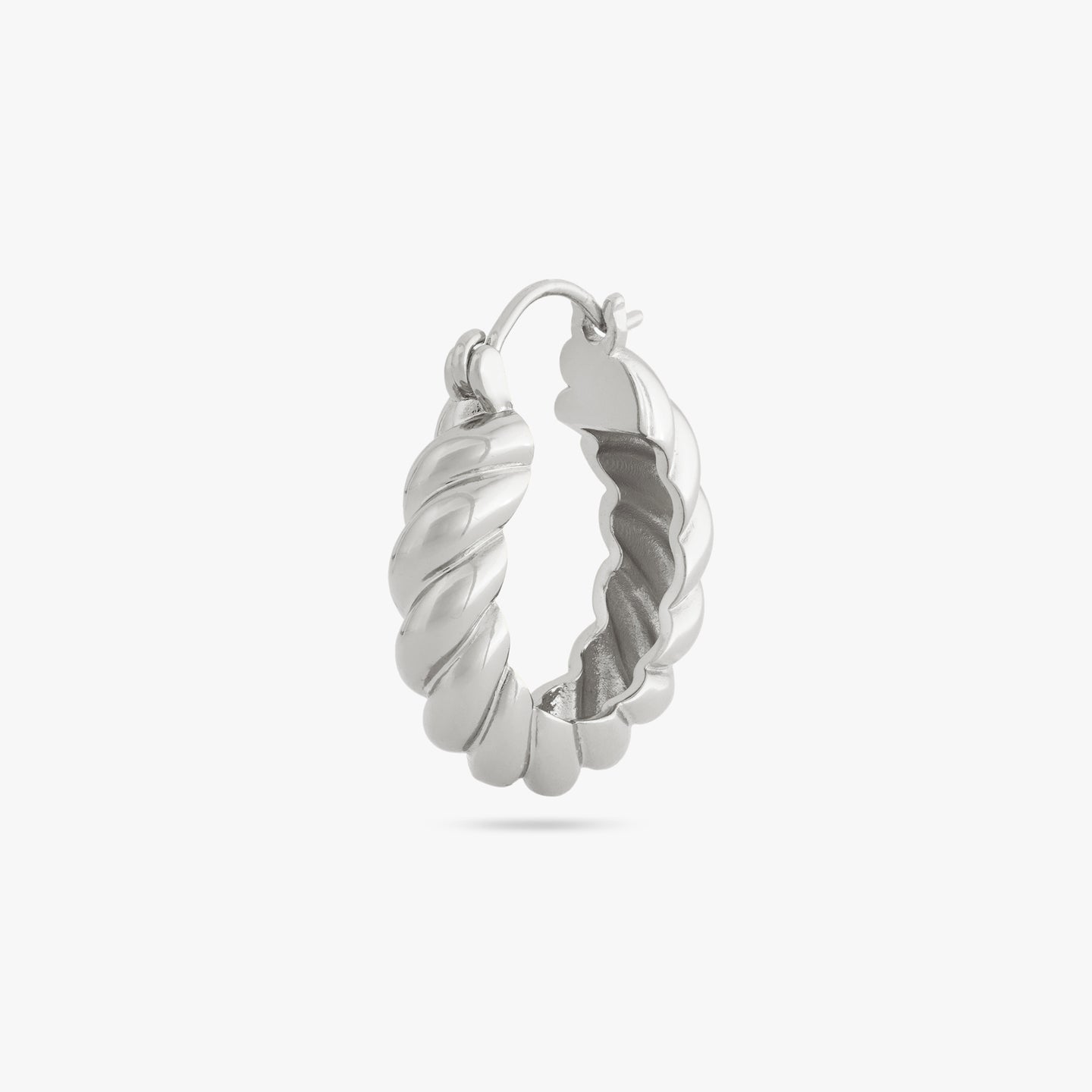 A medium sized silver hoop with french twist detailing color:null|silver
