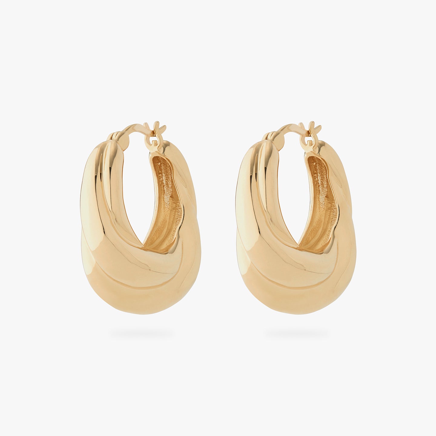 a pair of large chunky hoops that twist and are gold [pair] color:null|gold