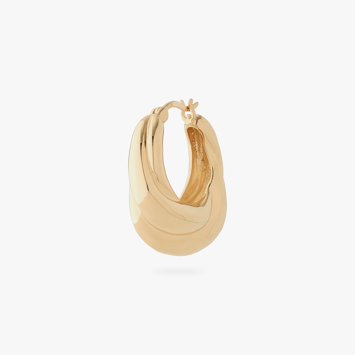 a large chunky hoop that twists and is gold color:null|gold