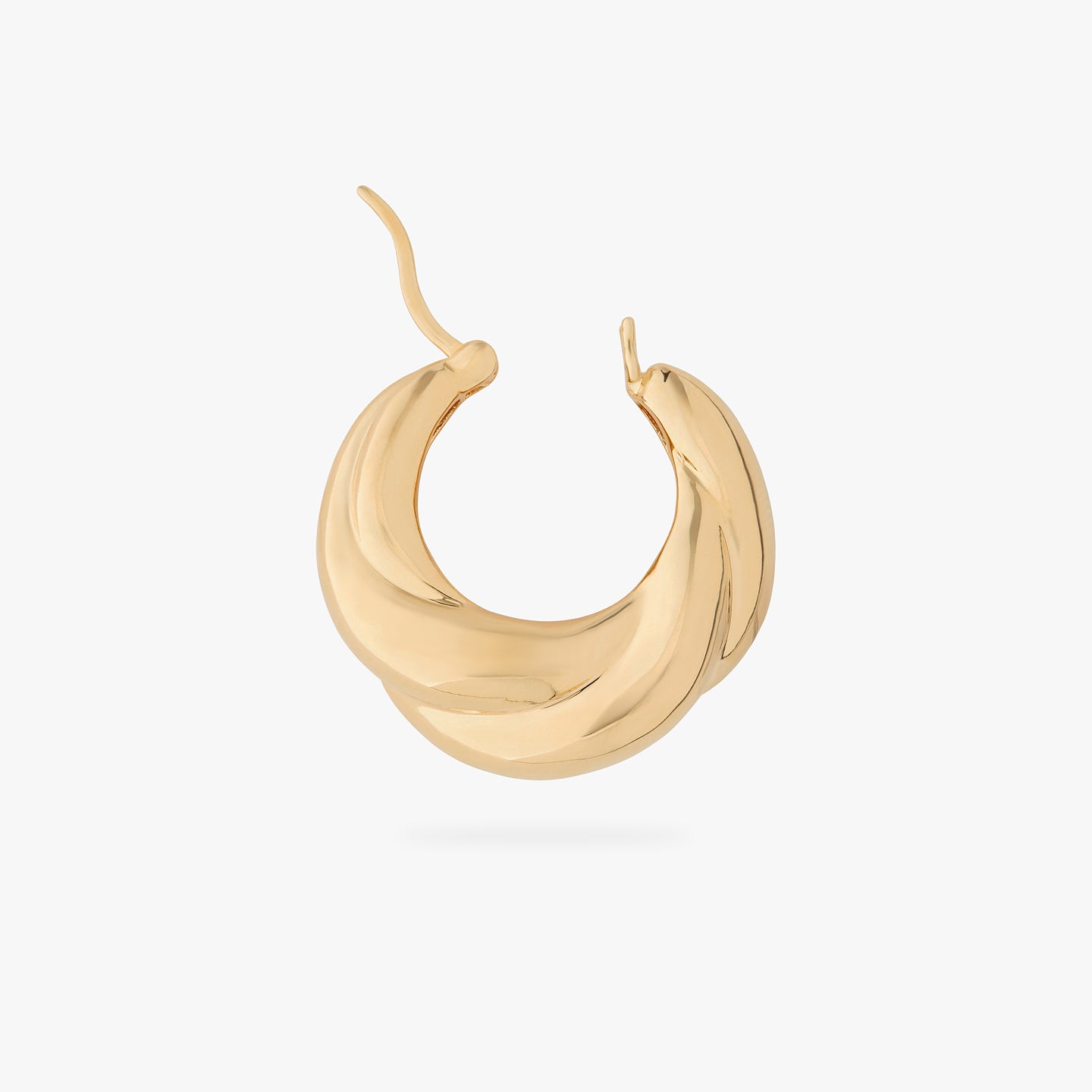 a large chunky hoop that twists and is gold unhinged color:null|gold