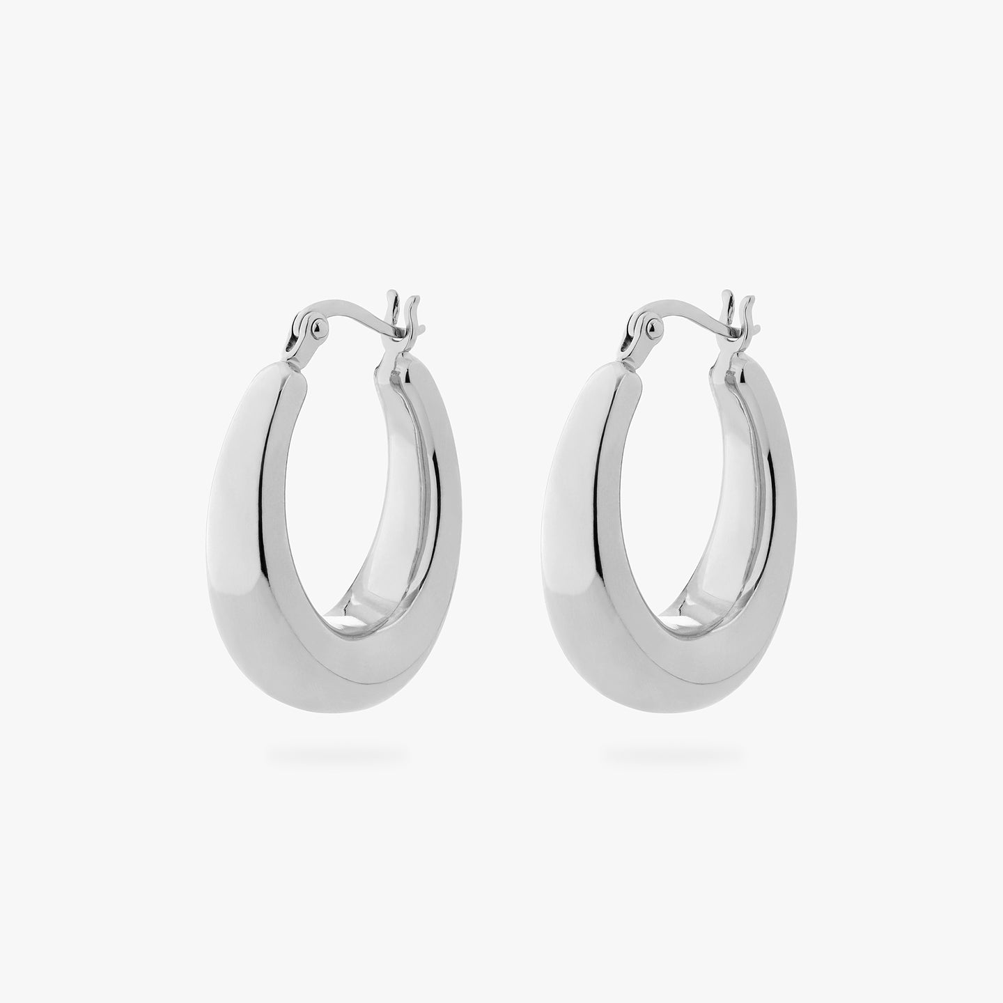 a pair of oval shaped hoop earrings in silver [pair] color:null|silver