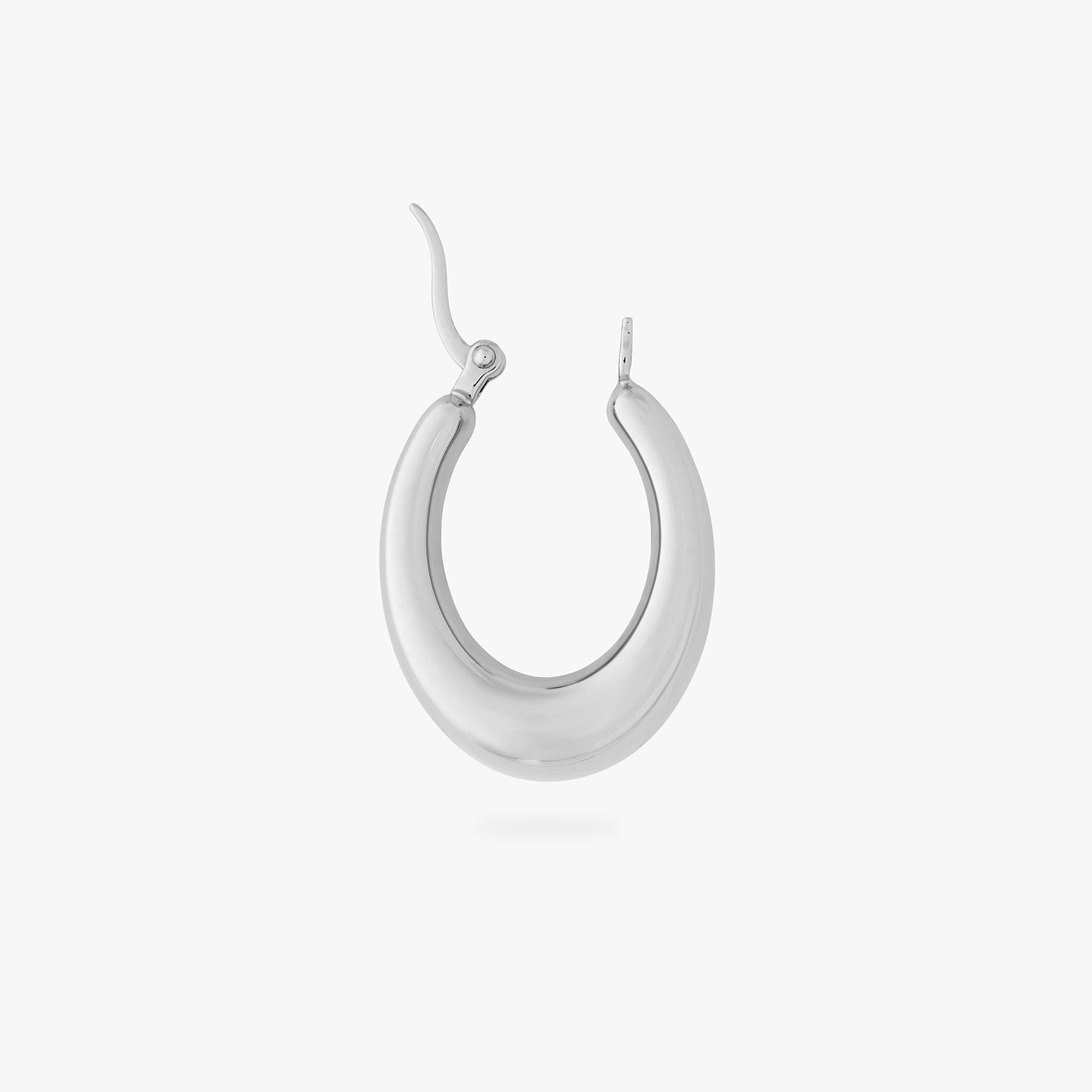 an oval shaped hoop earring in silver color:null|silver