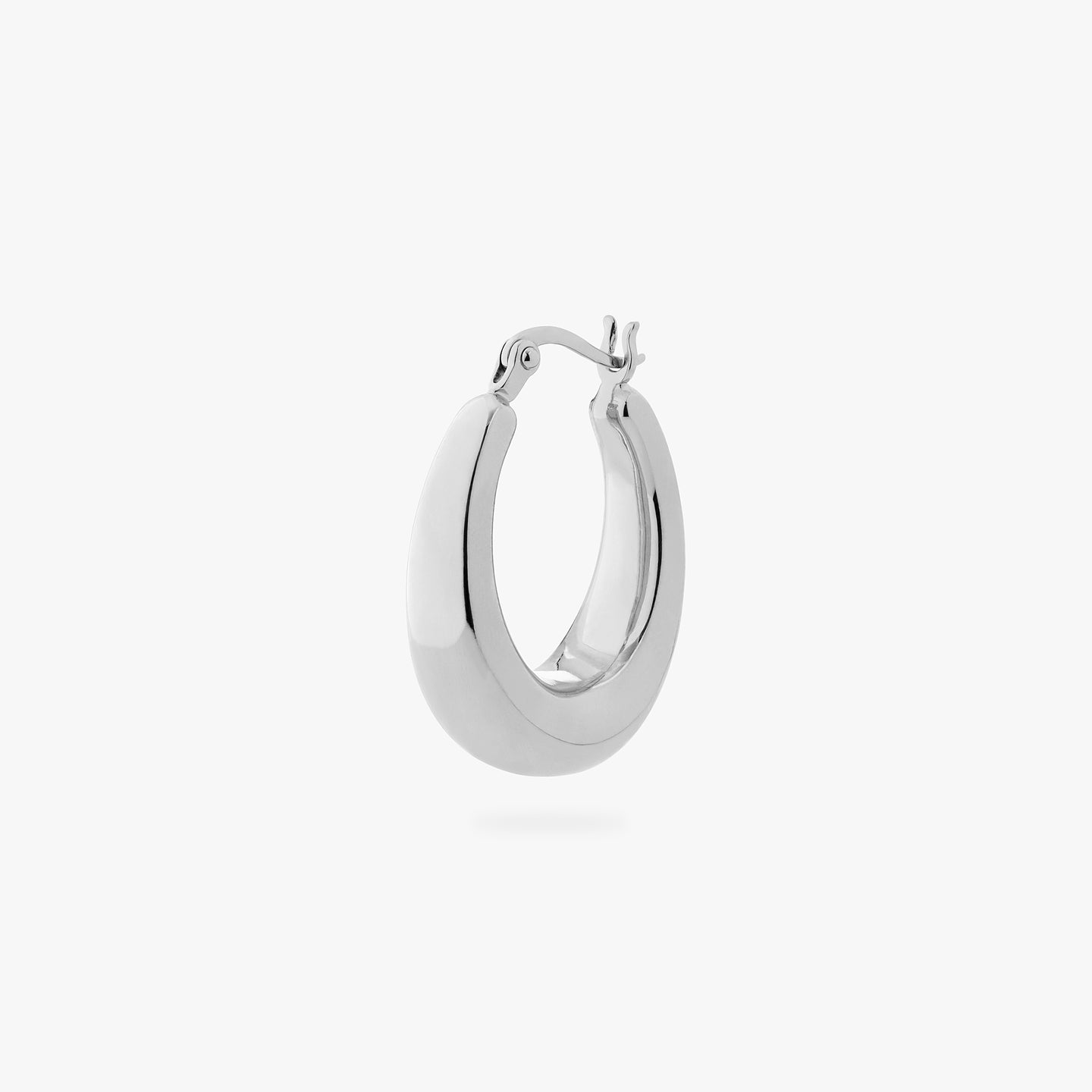 an oval shaped hoop earring in silver color:null|silver