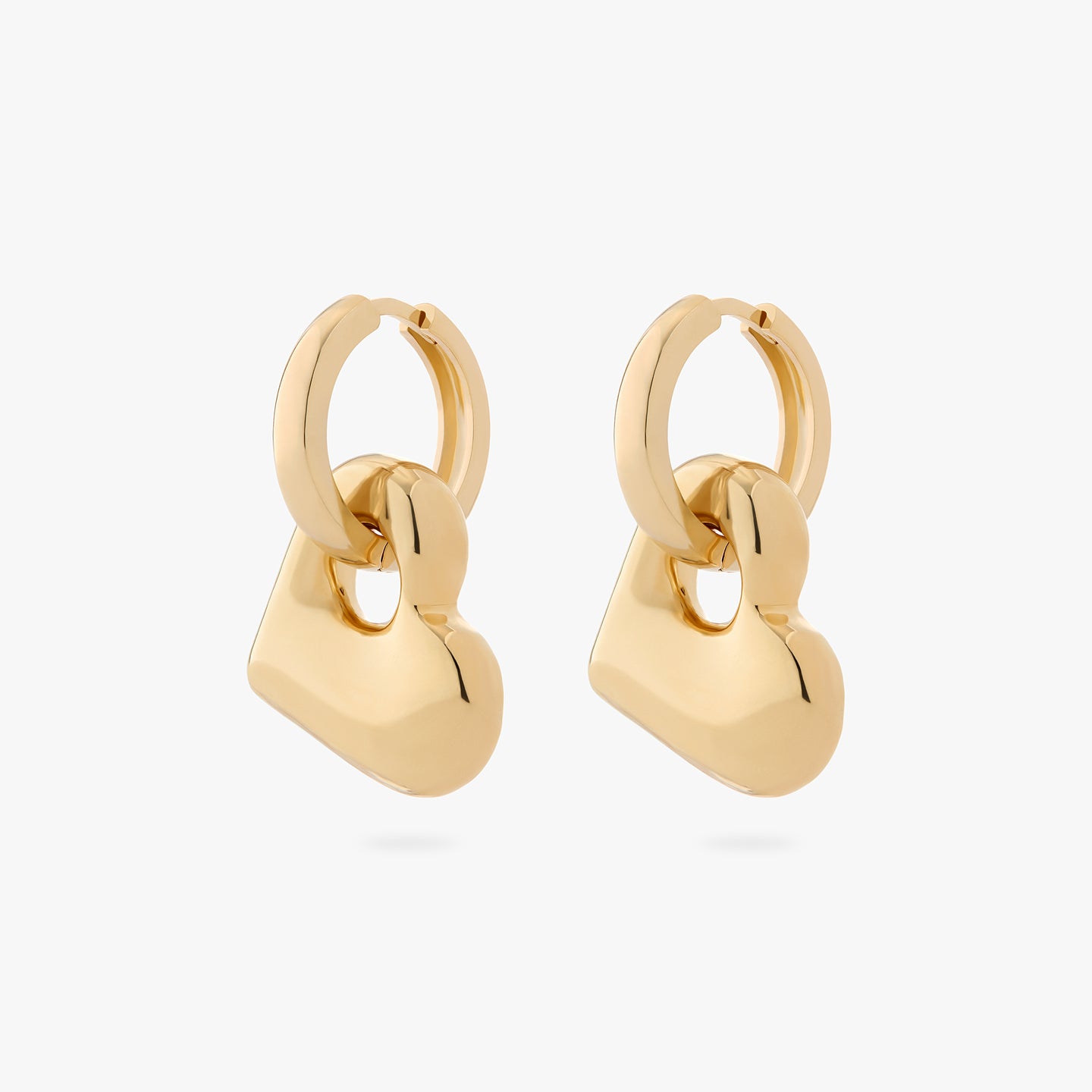 a pair of chunky gold hoops that have a gold puffy heart as a charm on them [pair] color:null|gold
