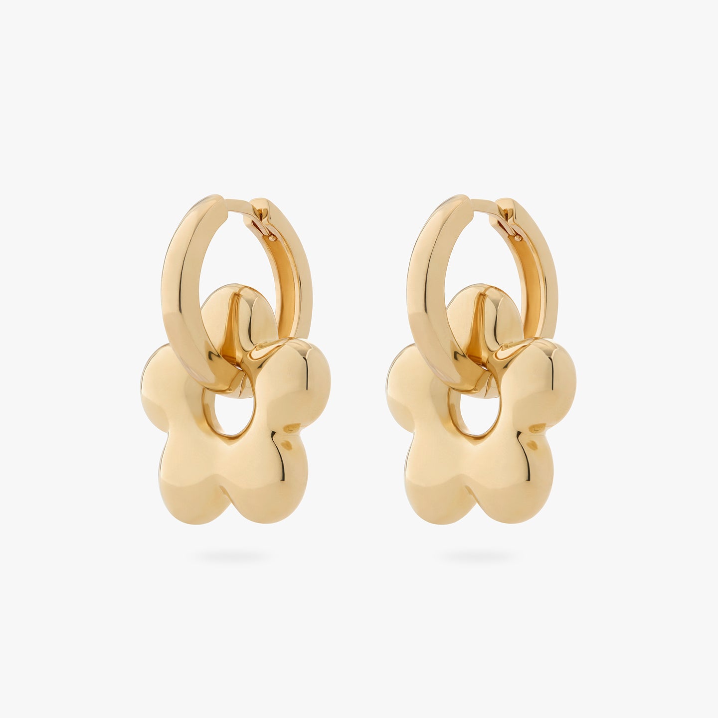 a pair of gold chunky hoops with gold charms in the shape of puffy daisies on them [pair] color:null|gold