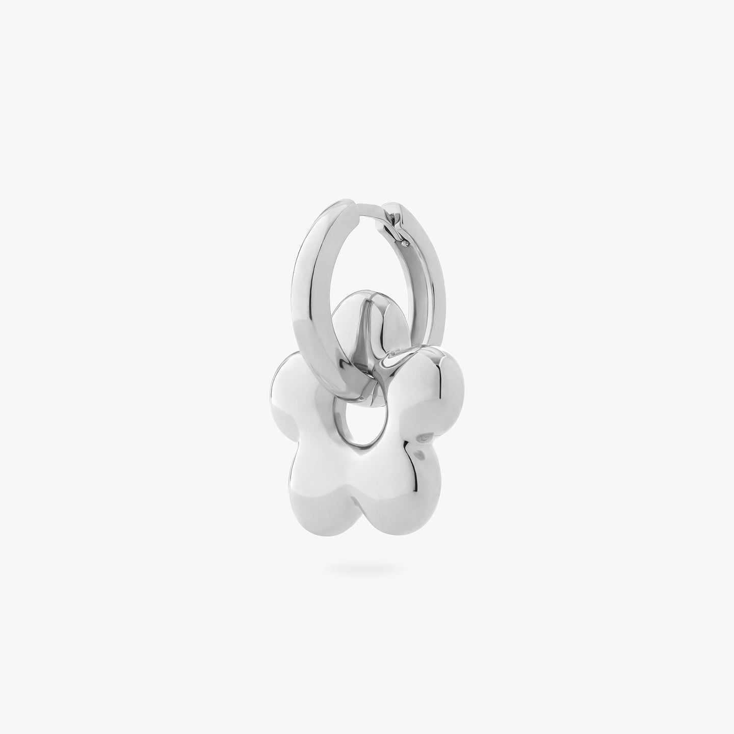 a silver chunky hoop with a silver charm in the shape of a puffy daisy on it color:null|silver