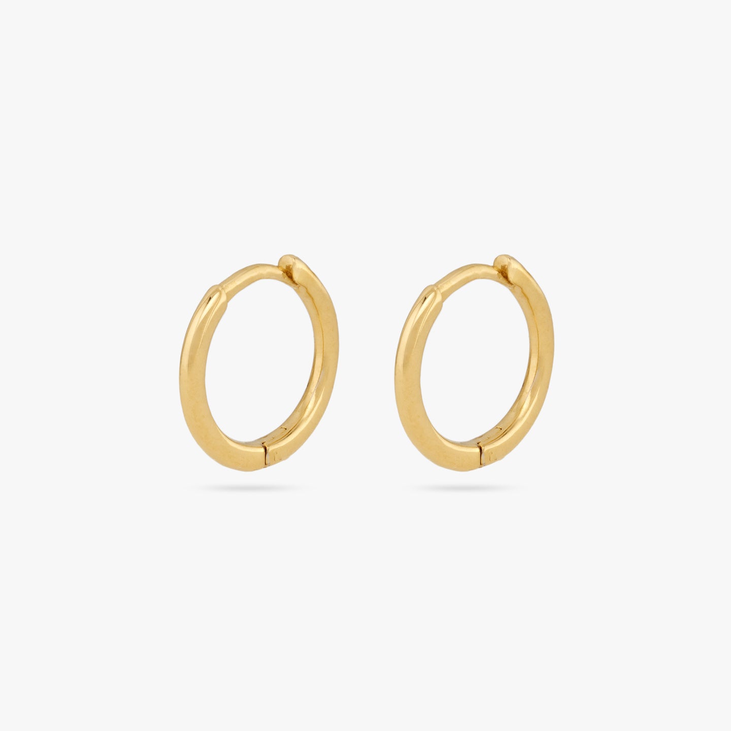This is a pair of small gold huggies with square edges [pair] color:null|gold