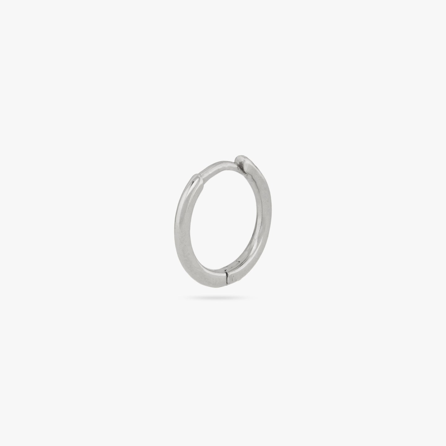 This is a small silver huggie with square edges color:null|silver