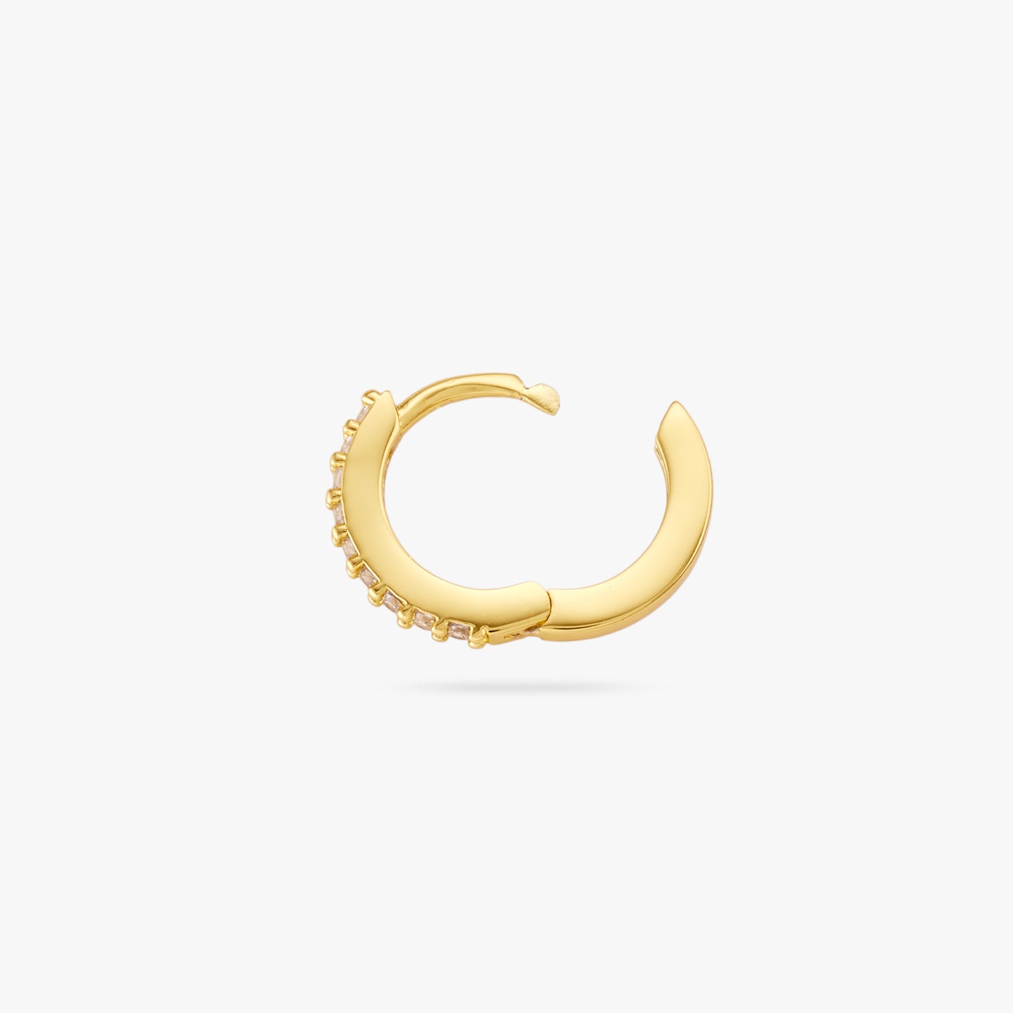 A mini gold huggie lined with clear cz gems on the front and its clasp undone color:null|gold/clear