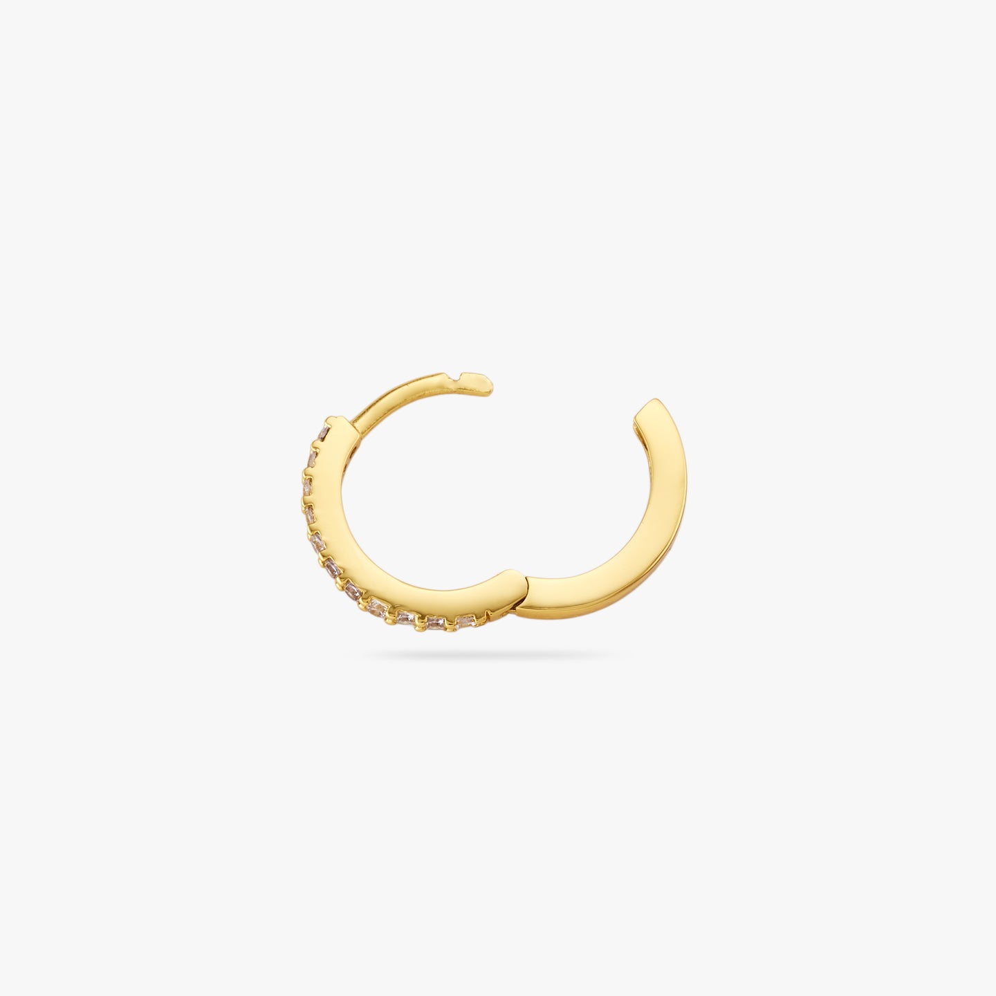 This is a small gold huggie measuring 13mm that features clear cz gems along the front color:null|gold/clear