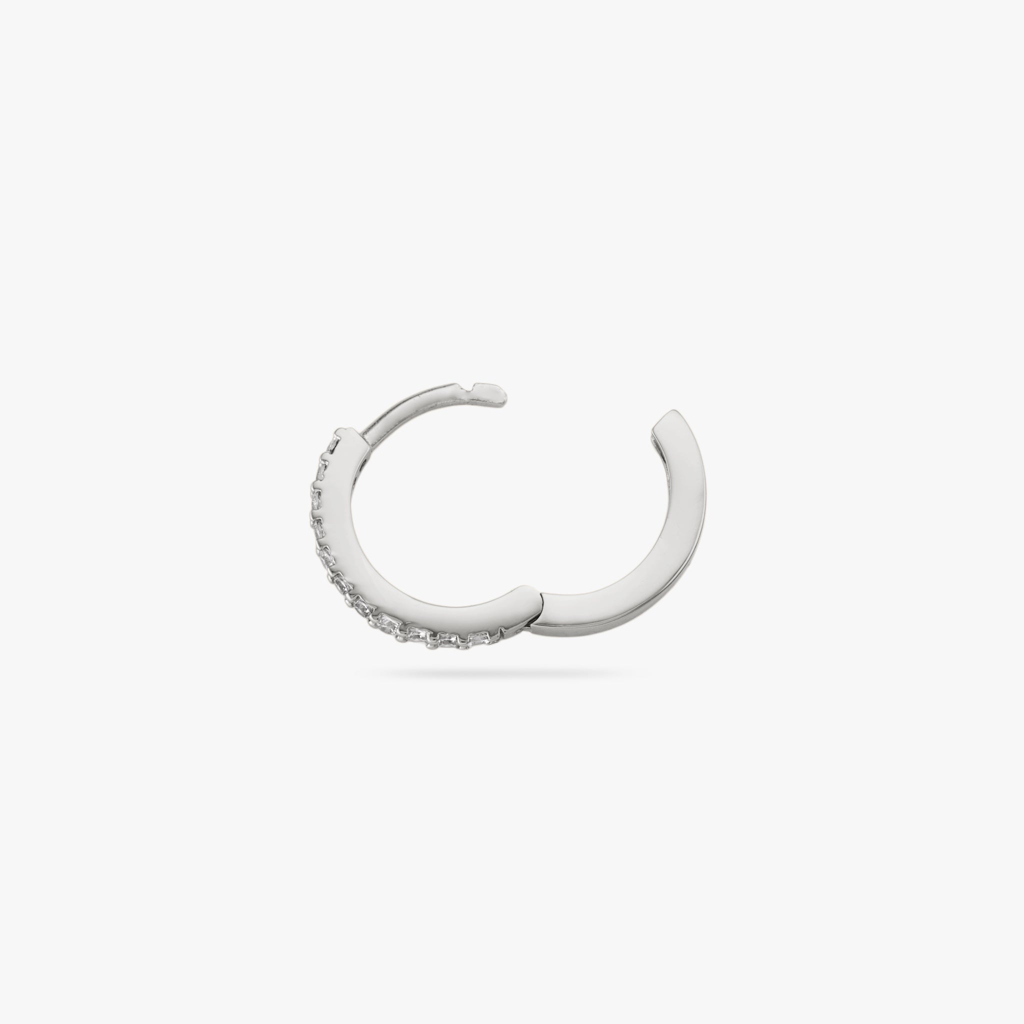 Silver huggie with clear CZs lining the front. color:null|silver/clear