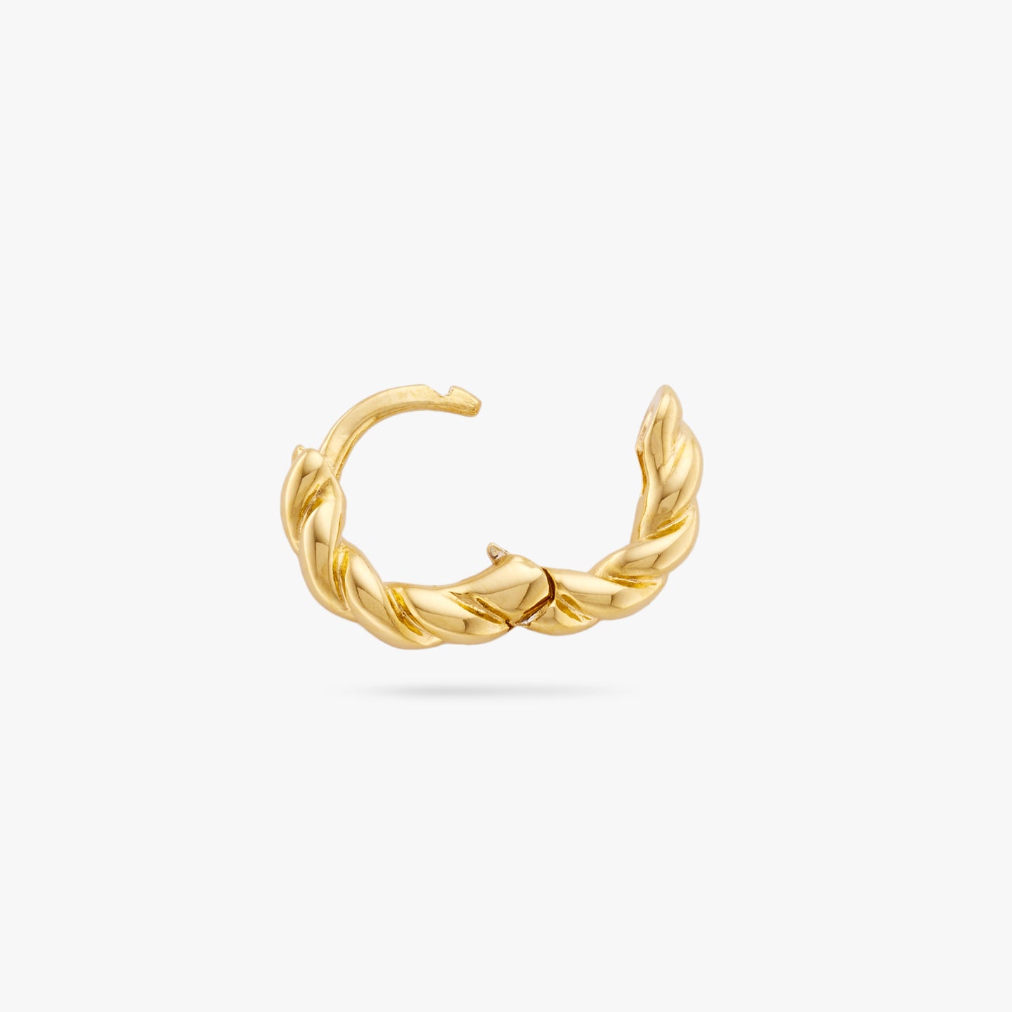 This is a small gold huggie with a twisted detail that has an open clasp color:null|gold