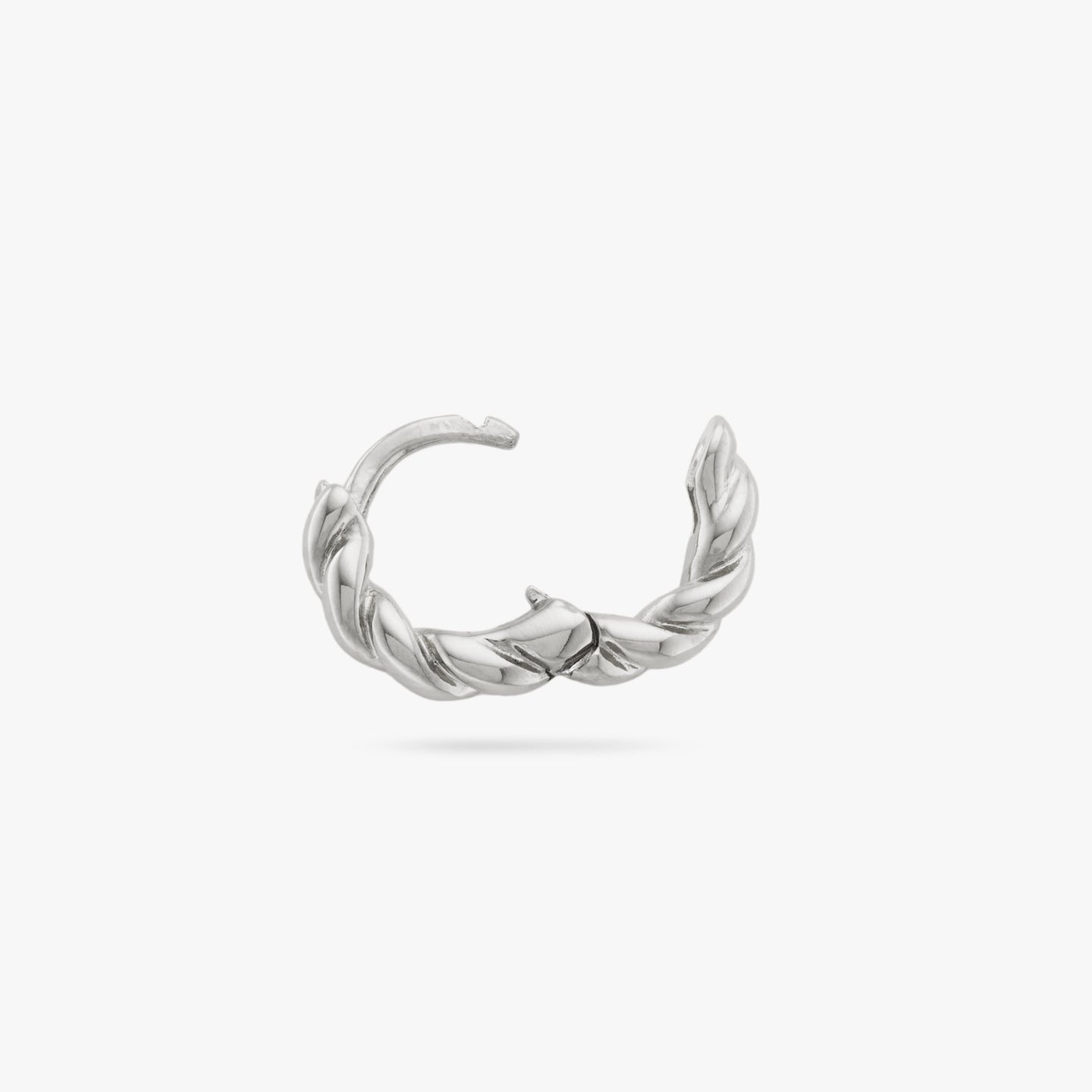 This is a small silver huggie with a twisted detail that has an open clasp color:null|silver