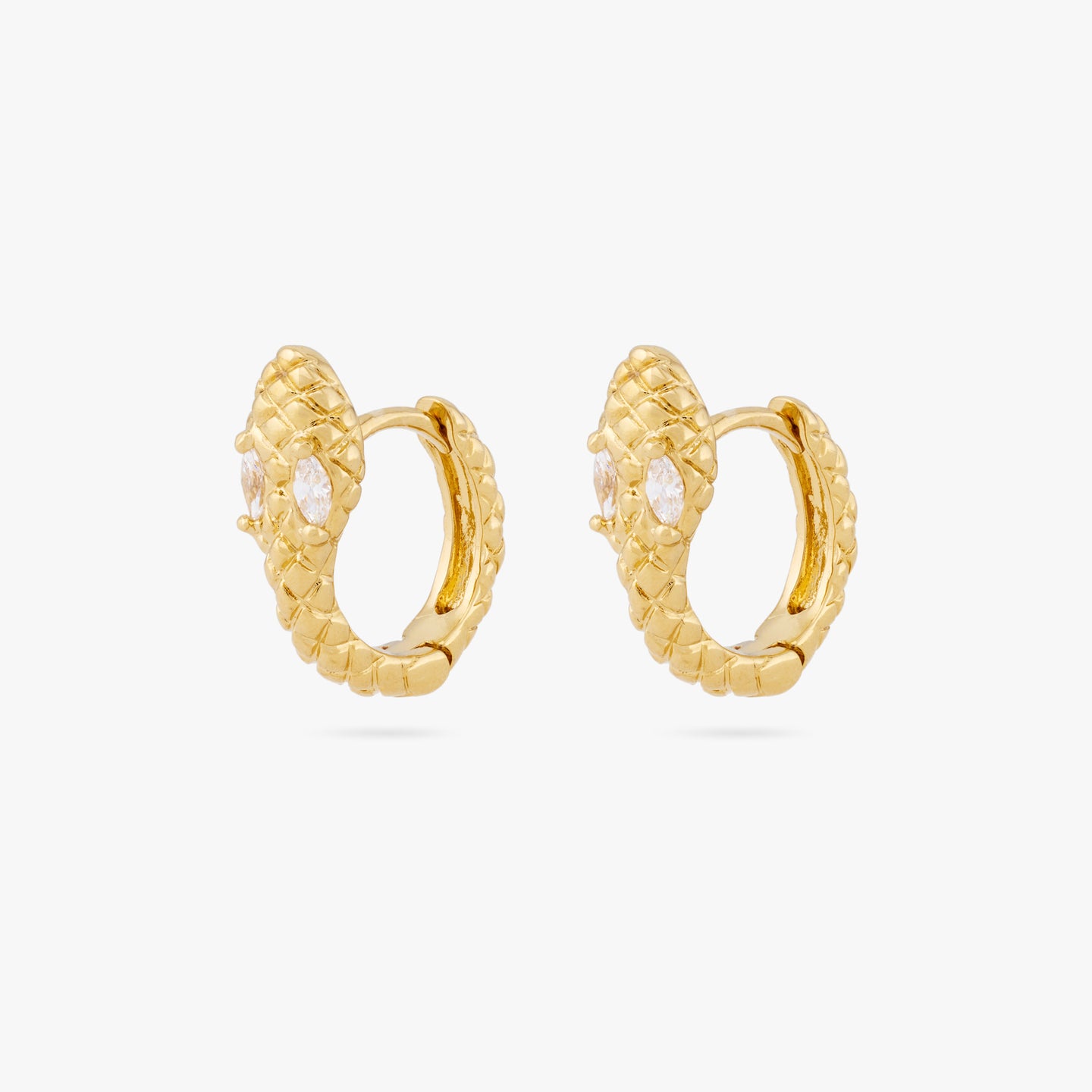 This is a pair of gold serpent shaped huggie earrings with clear CZ eyes [pair] color:null|gold