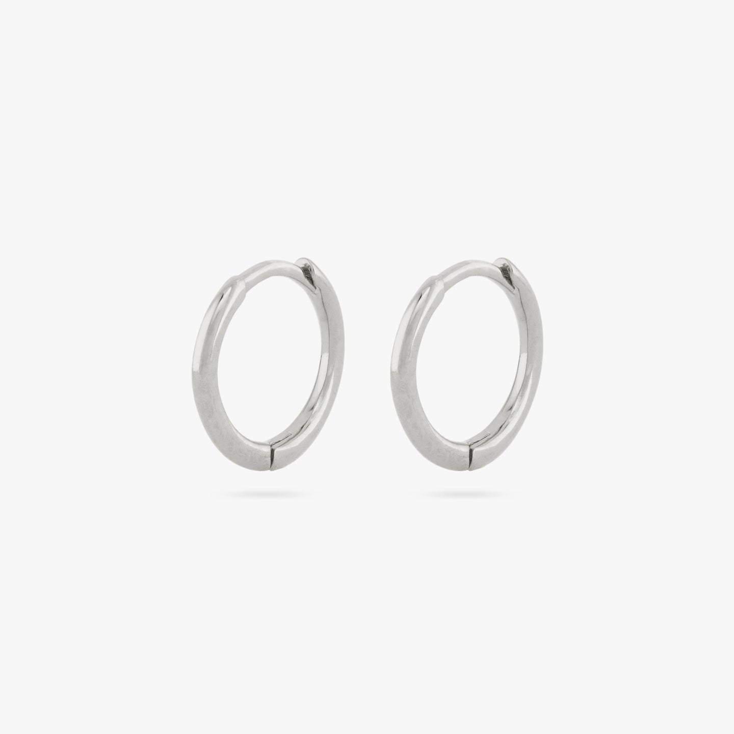 Pair of small slim silver huggies. [pair] color:null|silver