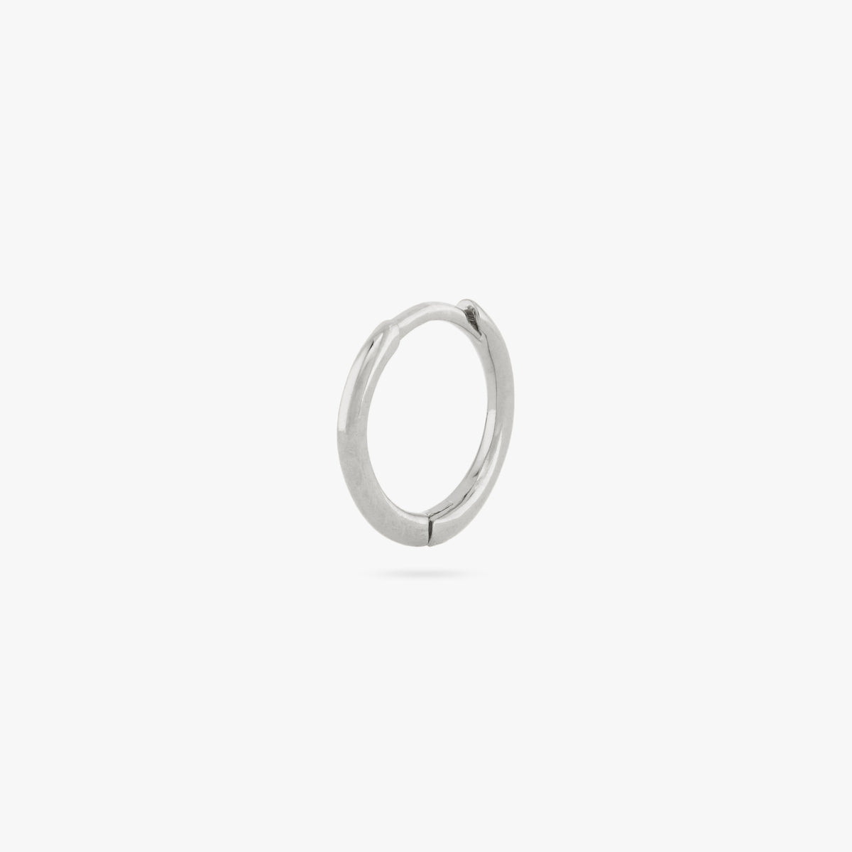 Small slim silver huggie. color:null|silver