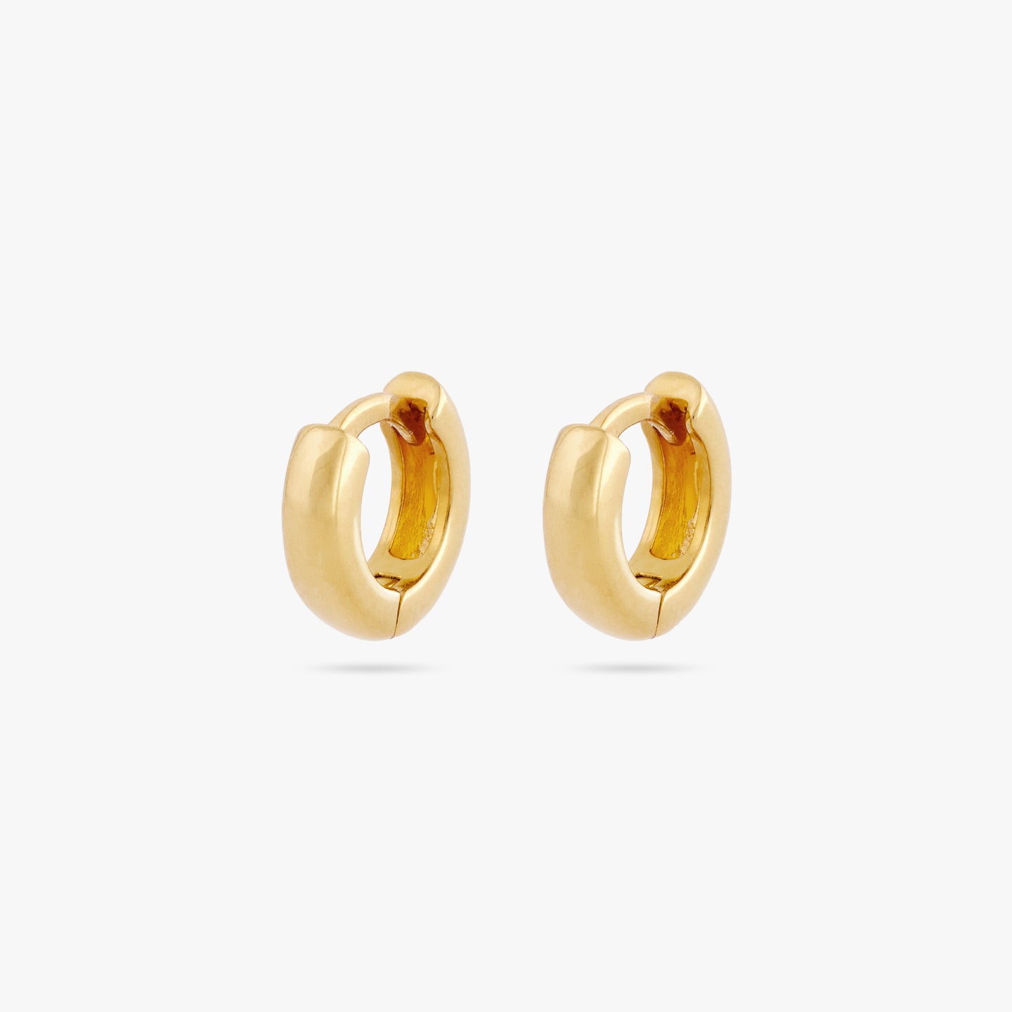 Pair of micro sized chunky gold huggies. [pair] color:null|gold