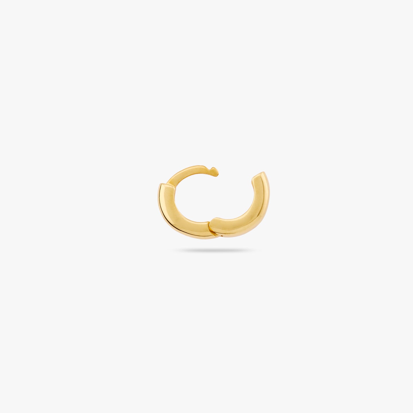 Micro sized chunky gold huggie. color:null|gold