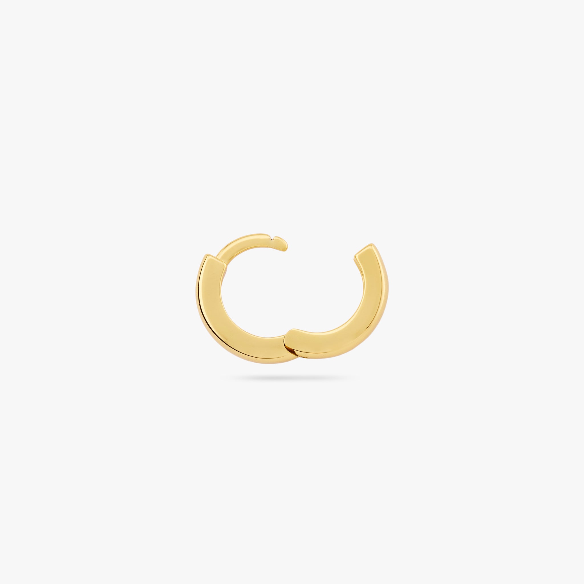 Mini sized chunky gold huggie. color:null|gold