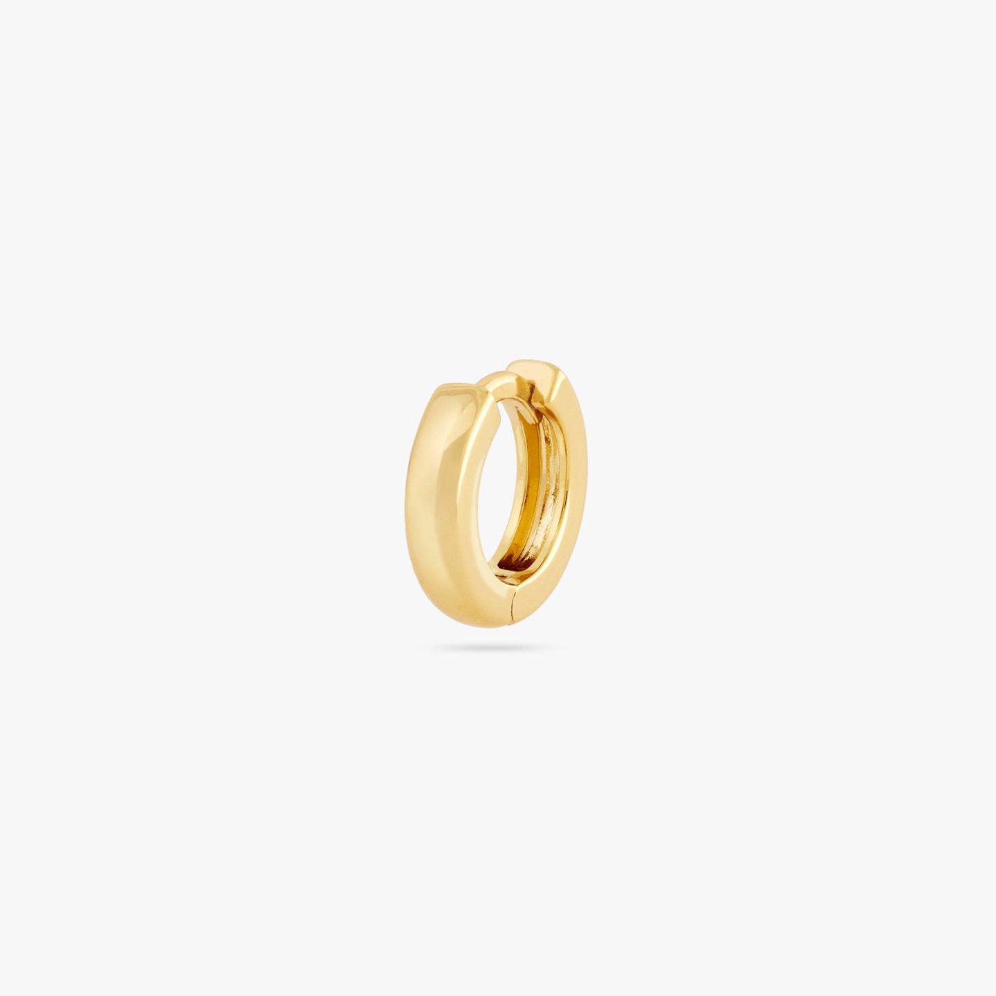 Mini sized chunky gold huggie. color:null|gold