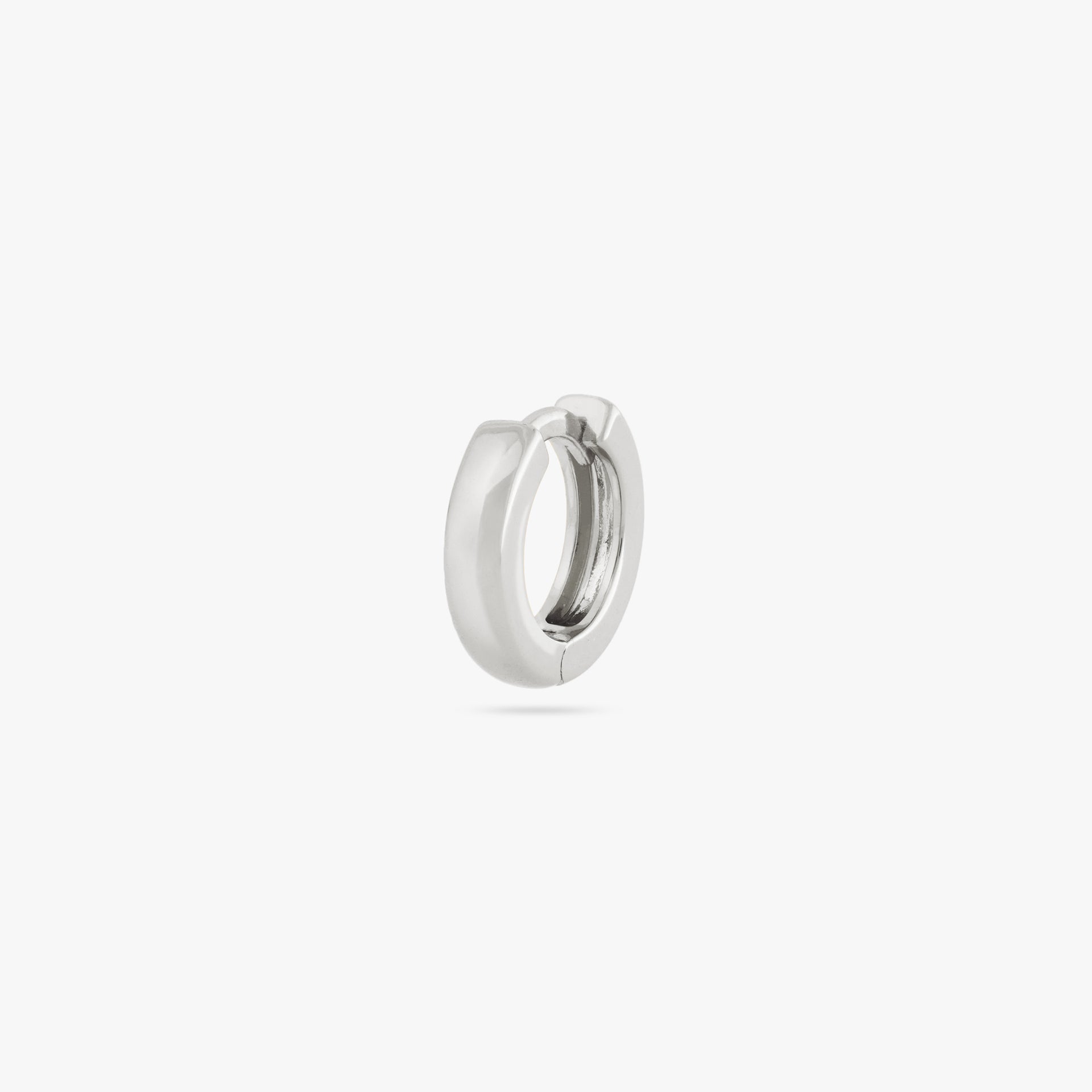 Mini sized chunky silver huggie. - Main view