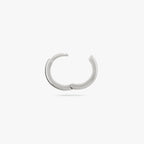 A small bulky and chunky shaped silver huggie and the clasp is undone color:null|silver
