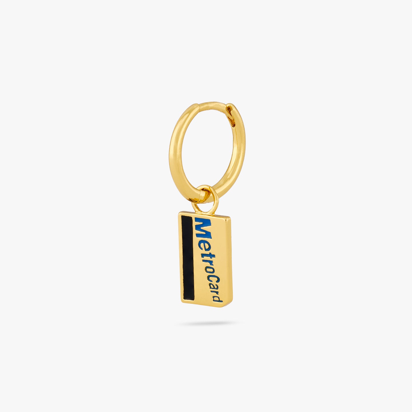 This is a small gold huggie with a metro card charm dangle color:null|gold