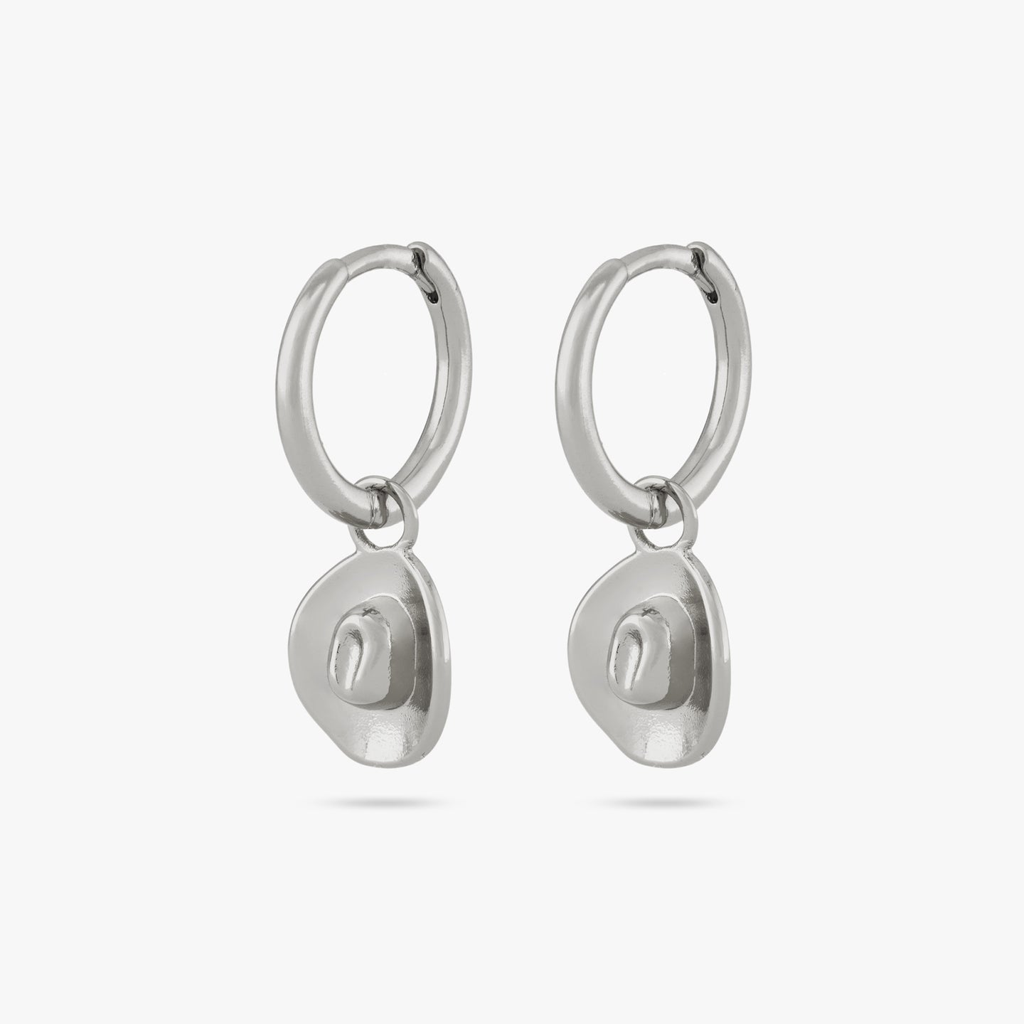 A pair of small silver huggies with a cowboy hat charm [pair] color:null|silver
