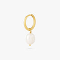 This is a dangling pearl huggie. color:null|gold