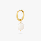 This is a dangling pearl huggie. color:null|gold