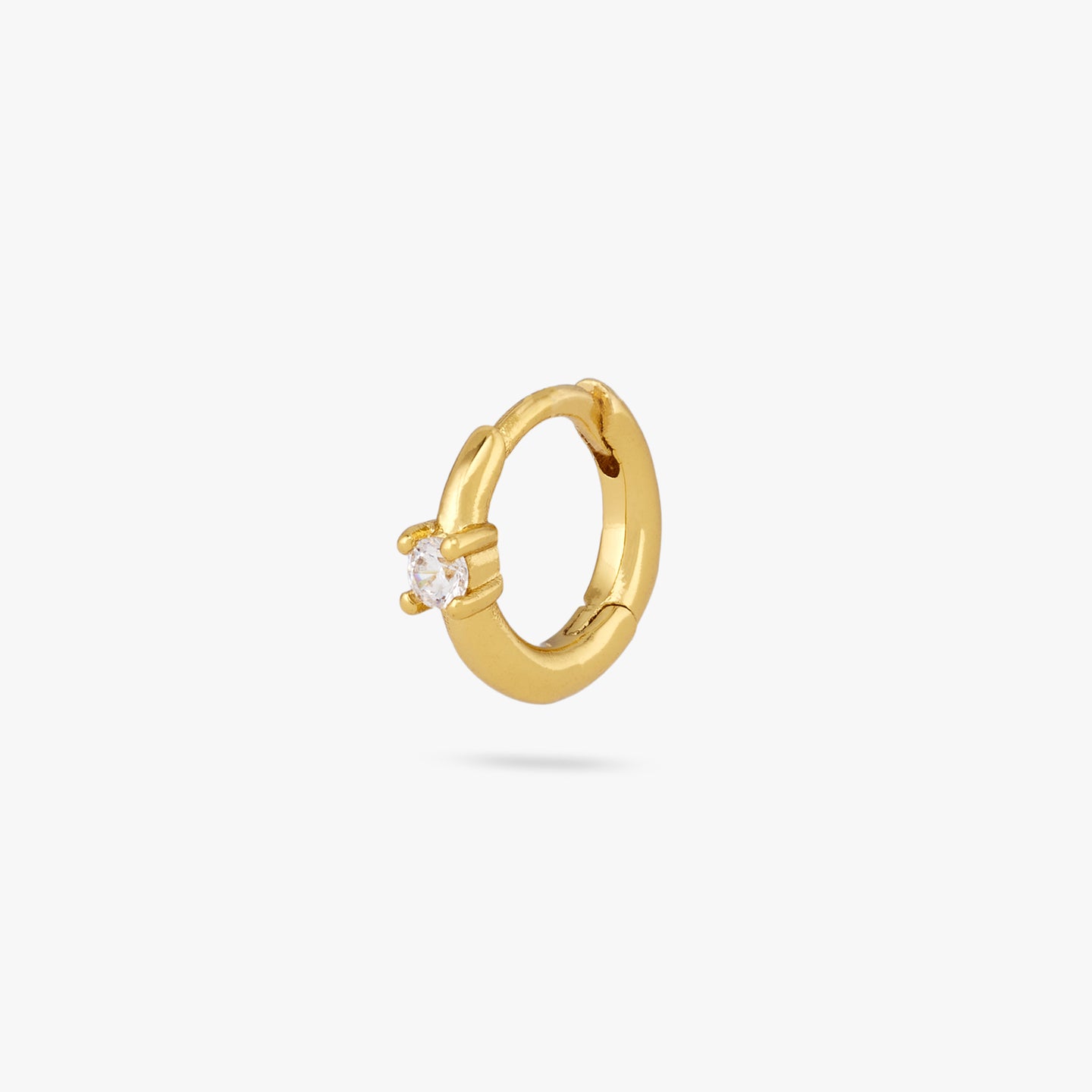 This is a small gold huggie with a clear cz detail in the center of the front color:null|gold/clear
