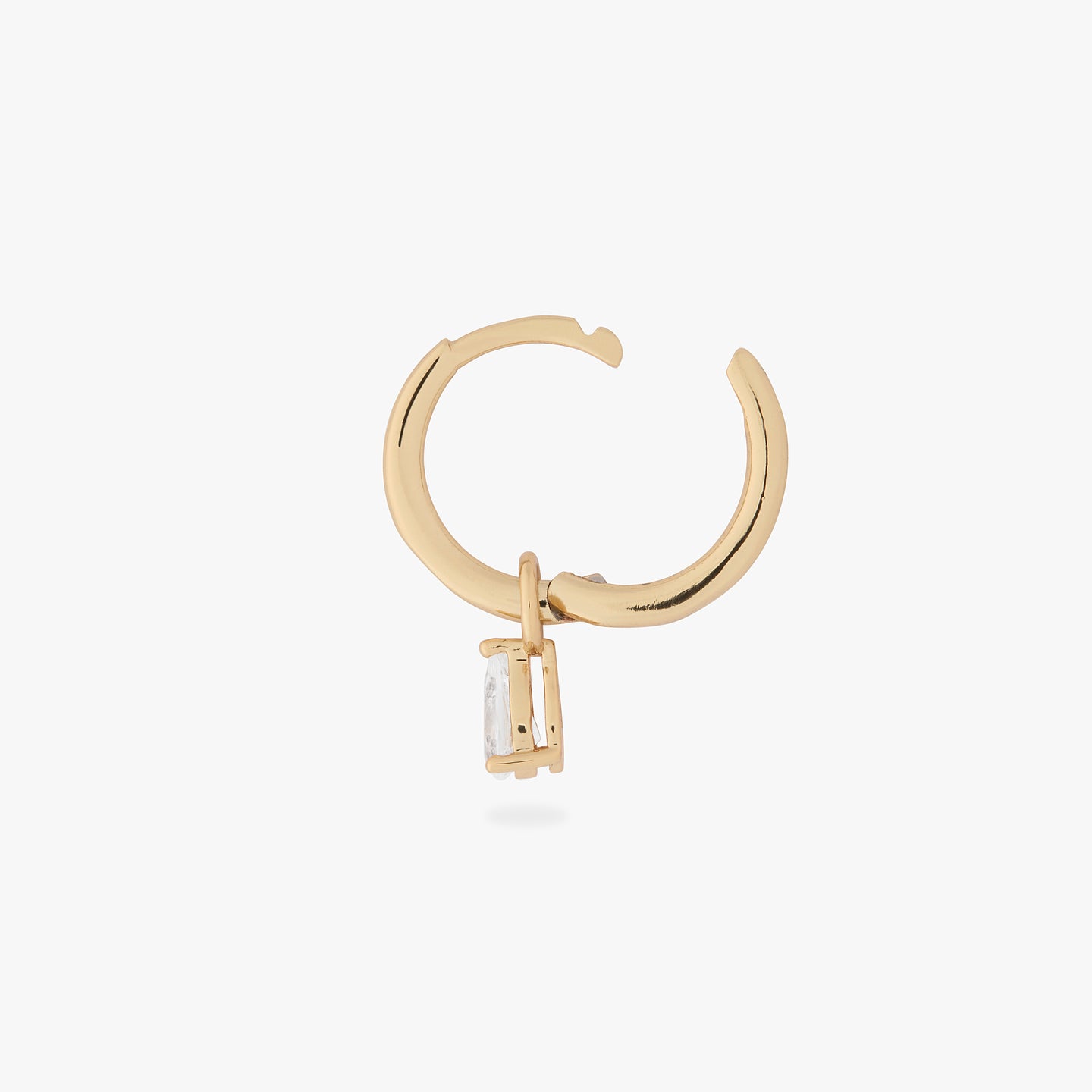 a gold small slim huggie with a pear shaped clear cz charm unhinged color:null|gold/clear