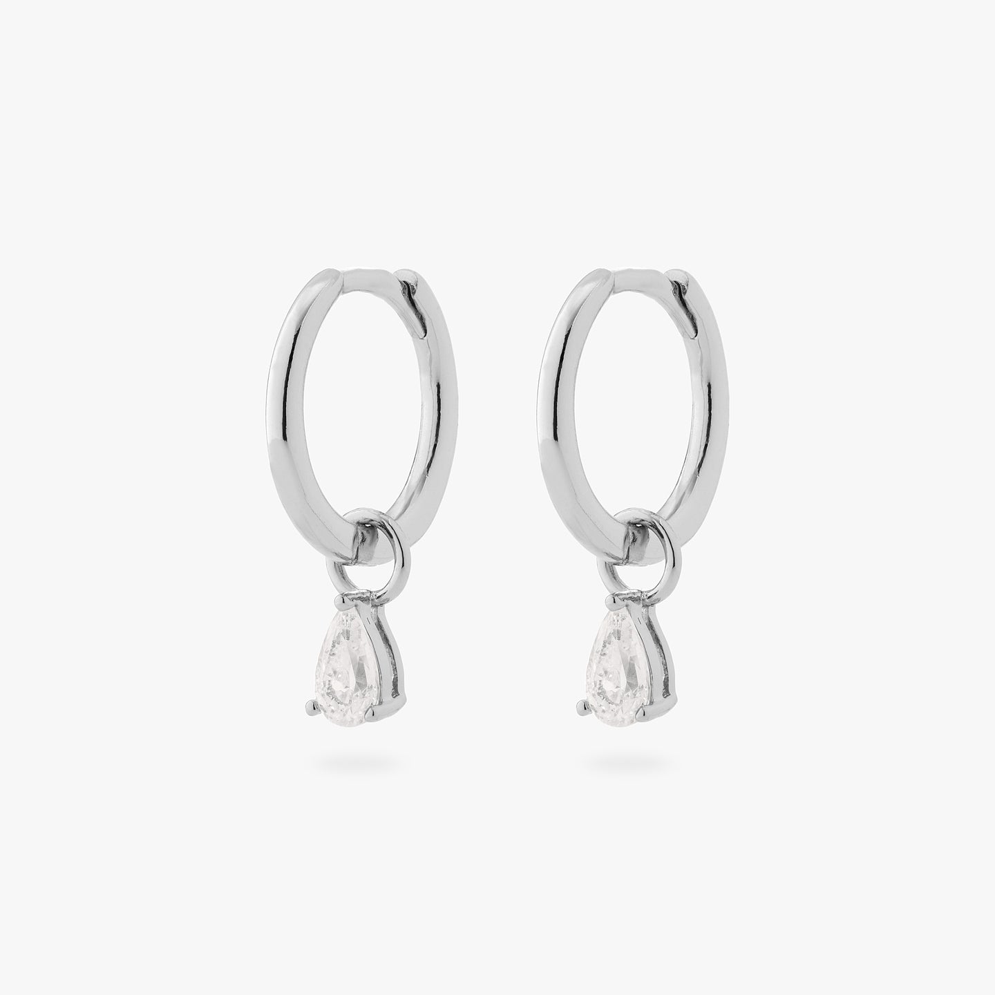 a pair of silver small slim huggies with pear shaped clear cz charms [pair] color:null|silver/clear