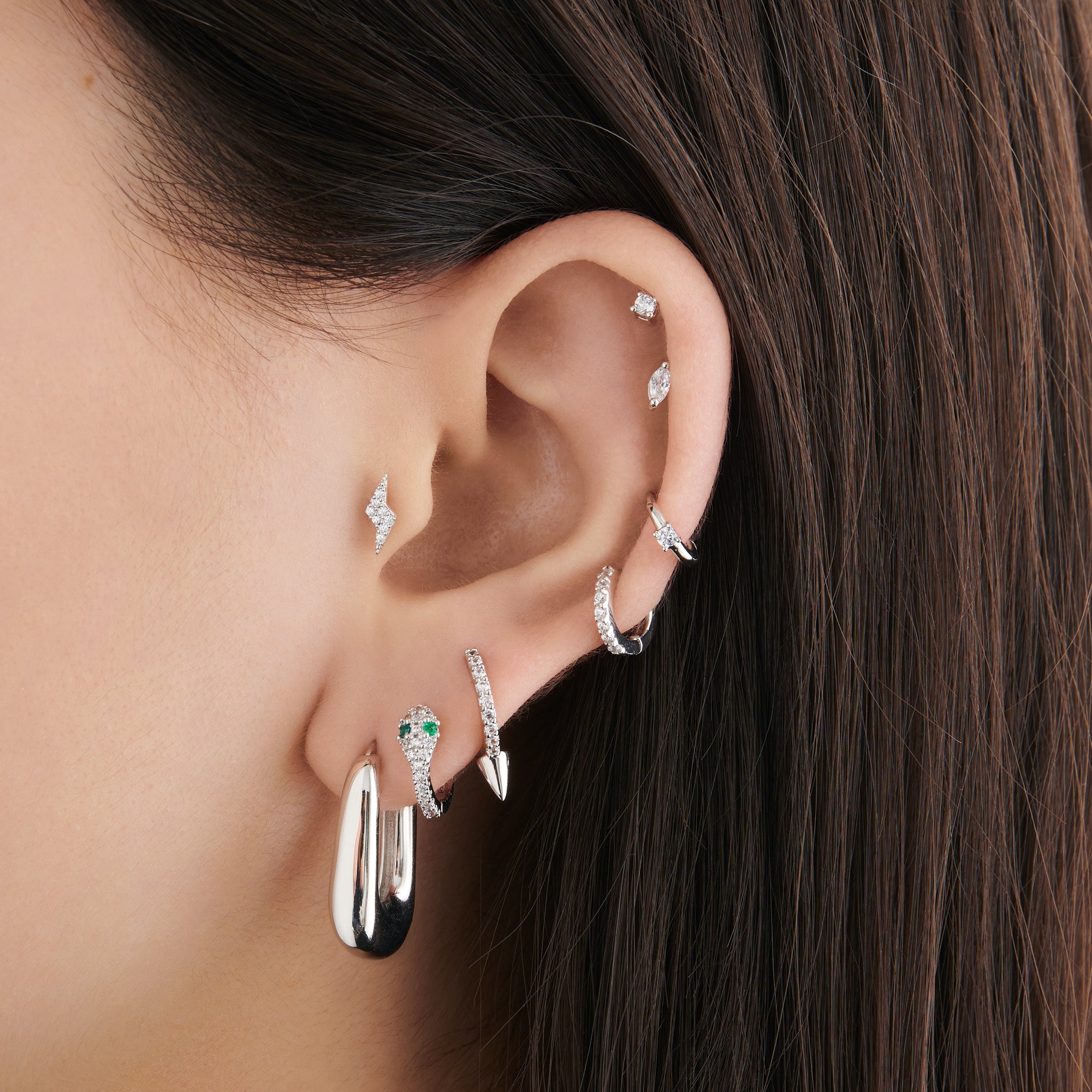 A clear/silver micro pave huggie with a 6mm inner diameter [hover] color:null|silver/clear