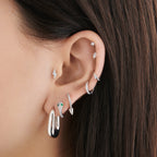 A clear/silver micro pave huggie with a 6mm inner diameter [hover] color:null|silver/clear