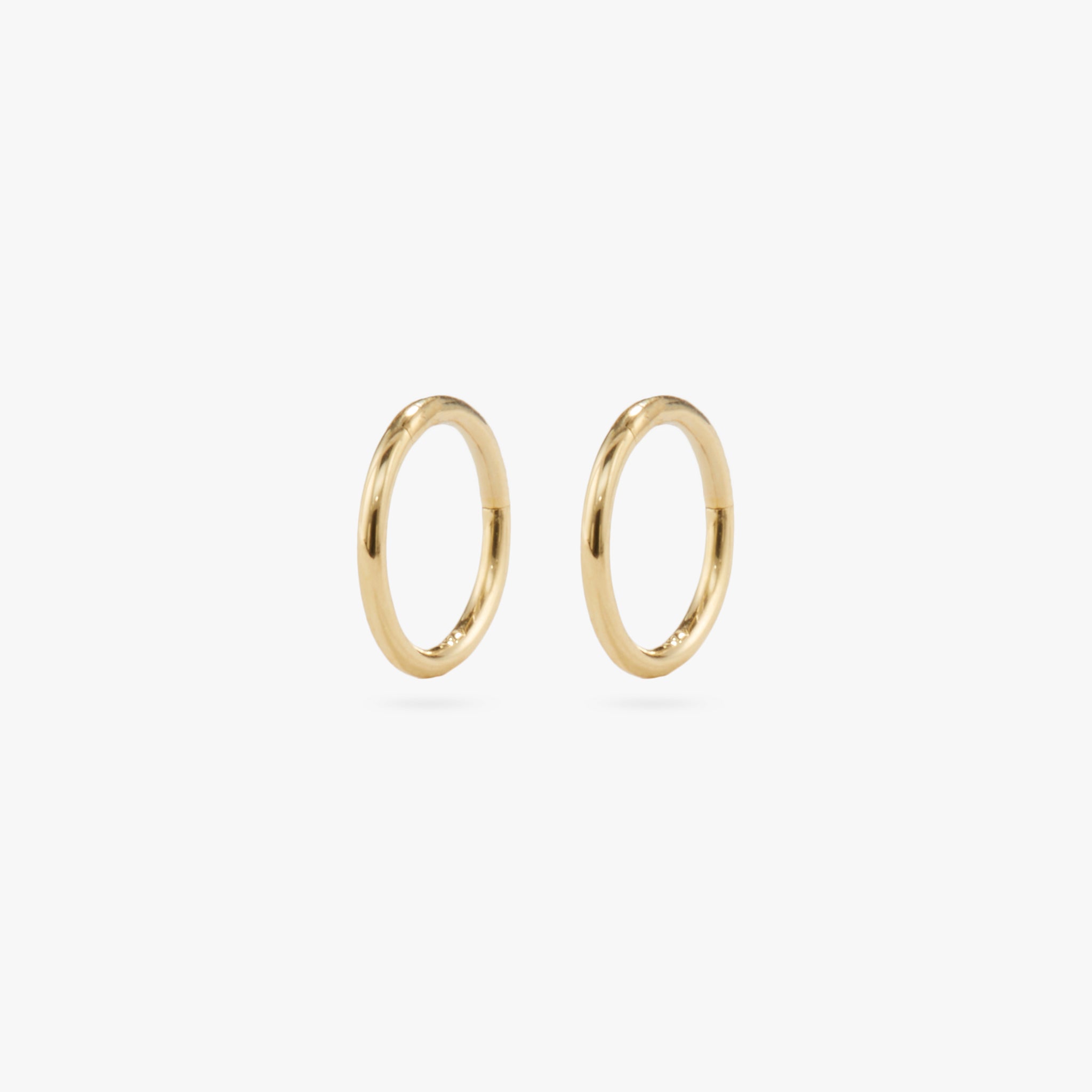 This is a gold clicker earring [pair] color:null|gold